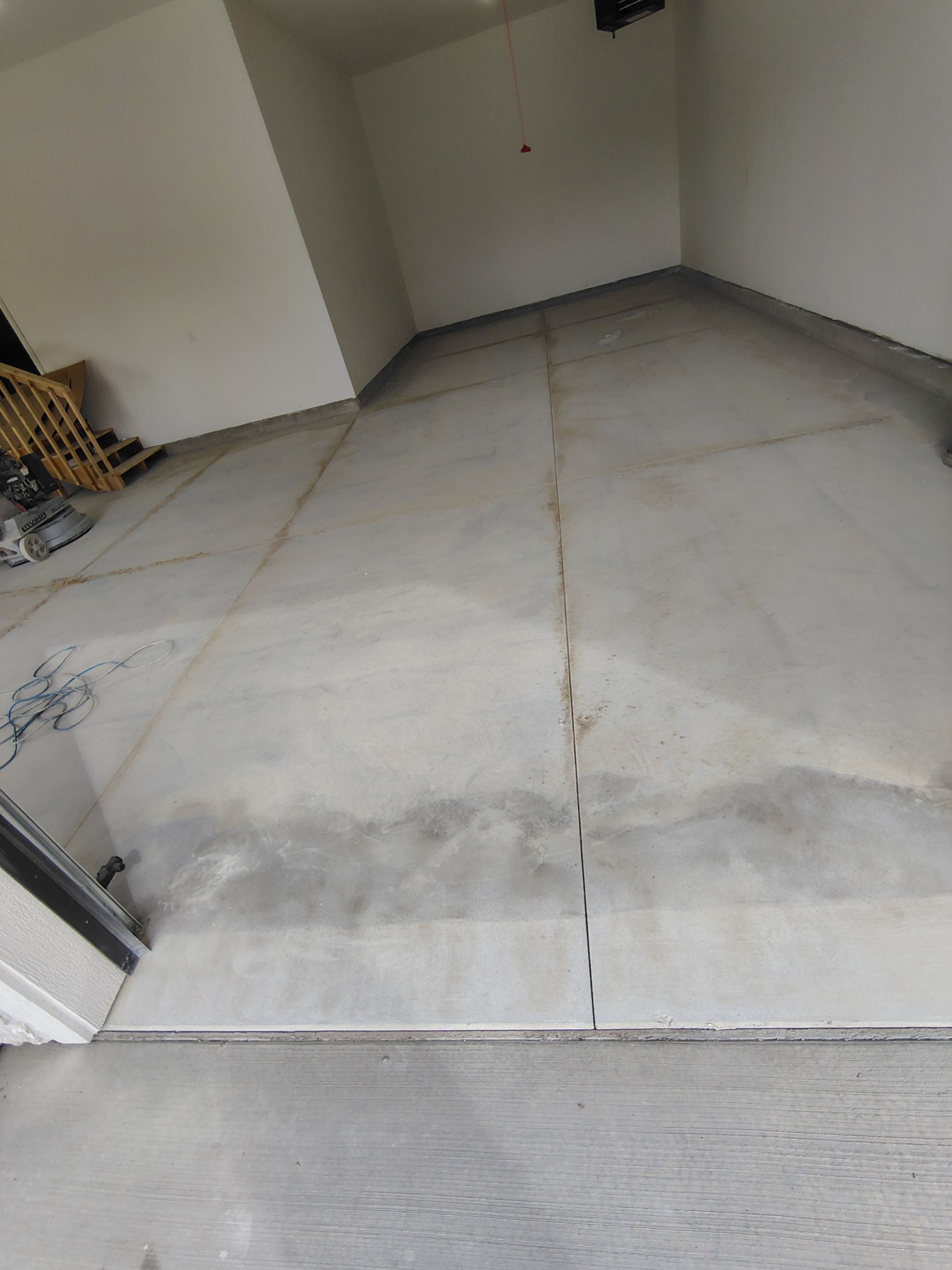 Sioux Falls Garage Floor Transformation with Gray Decorative Flake Coating by Select Painting, Coatings & Garage Cabinets