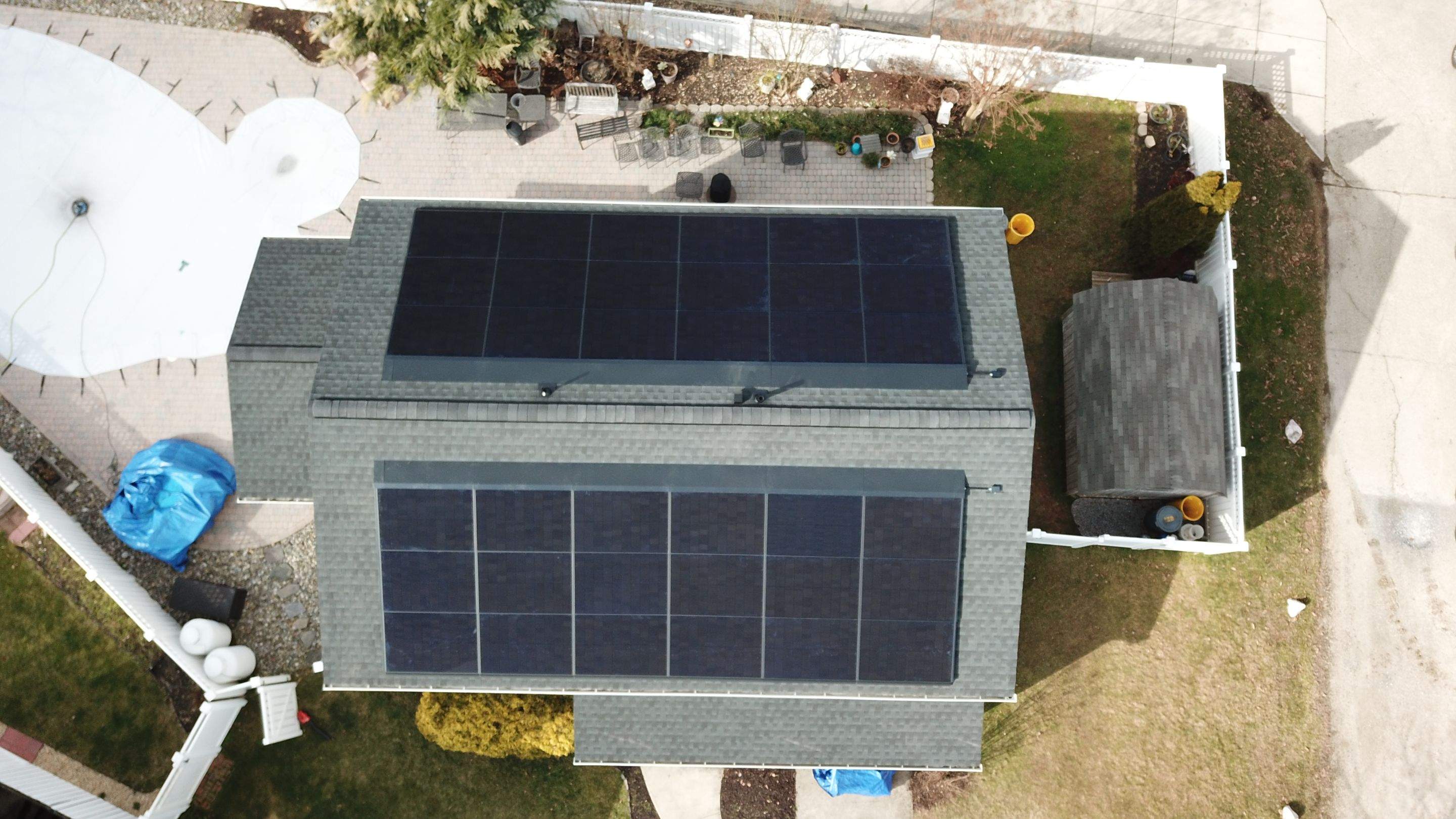 Roof Replacement with GAF Decotech integrated solar panels by American Home Contractors