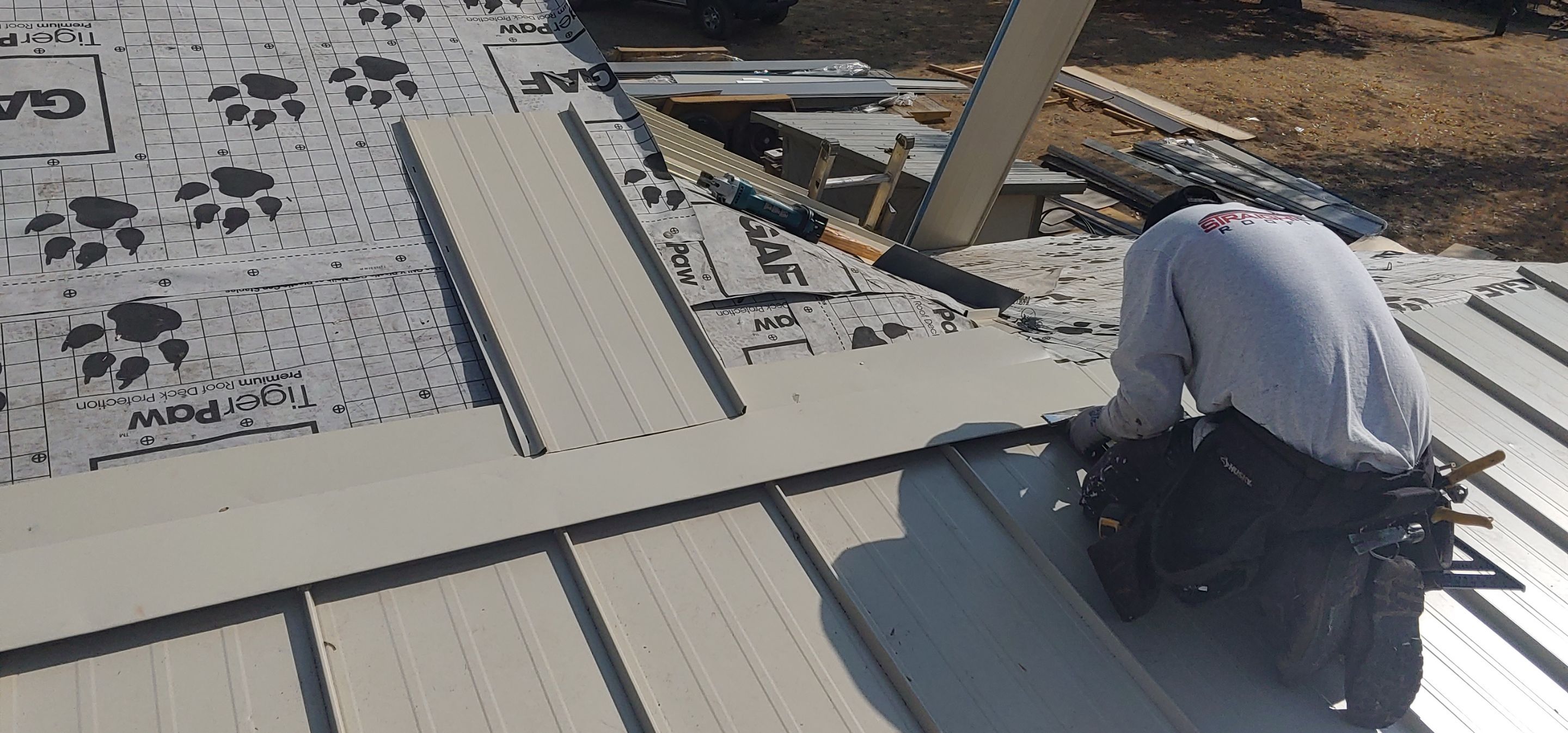 Residential Roofing Installation using Standing seam metal roofing system by Straight Edge Roofing Inc