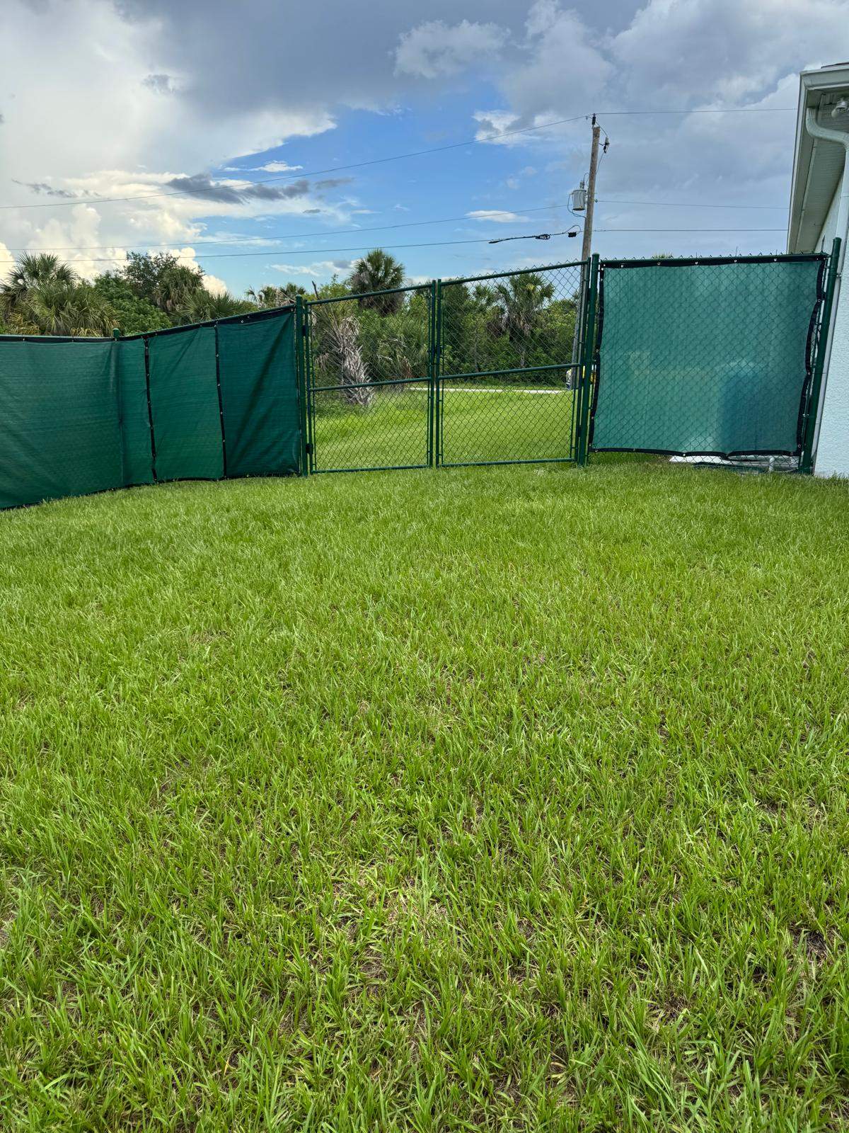 Chain Link Fence Installation with Custom Beach Privacy Screen in Port Charlotte by True Fence LLC