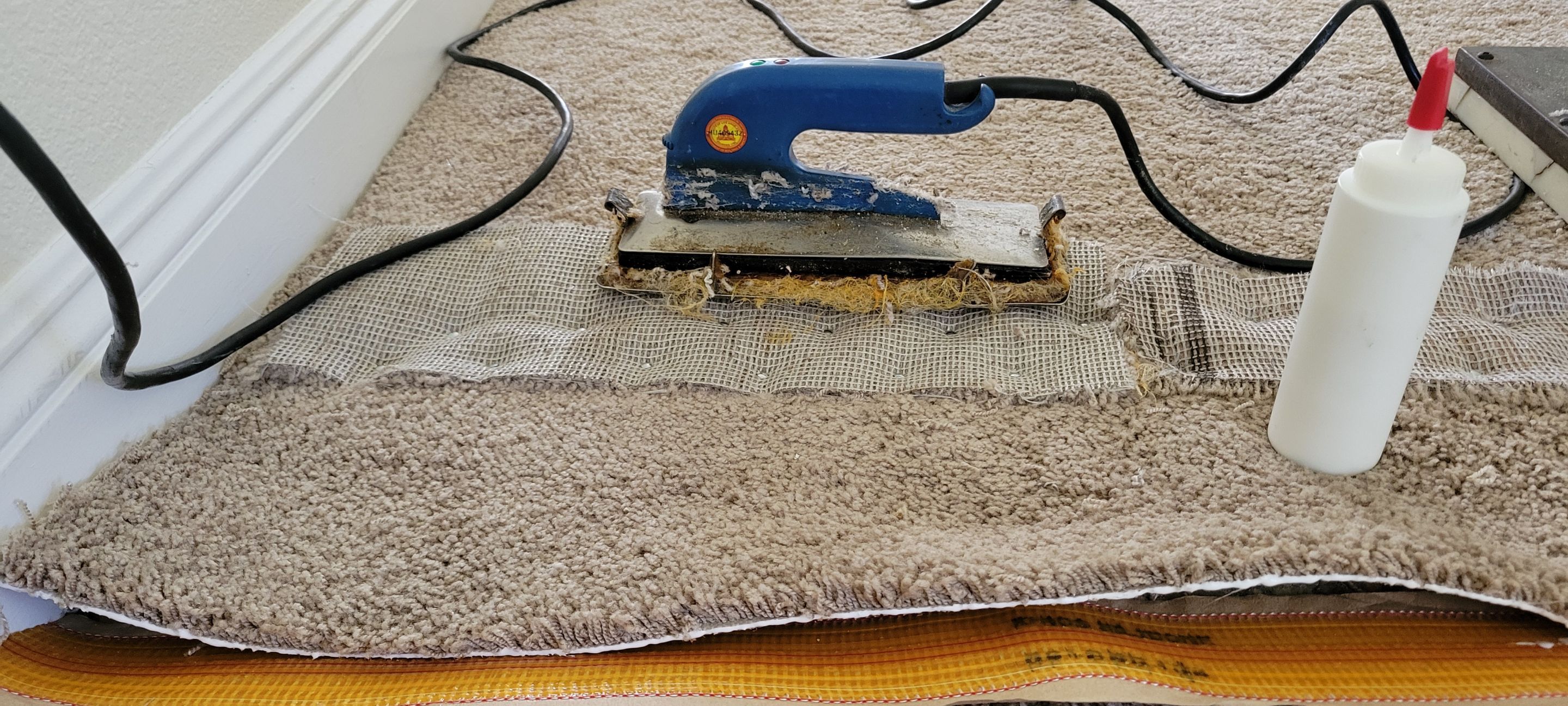 Stretching Hallway Carpet of a Rental by Ardent Carpet Restore LLC
