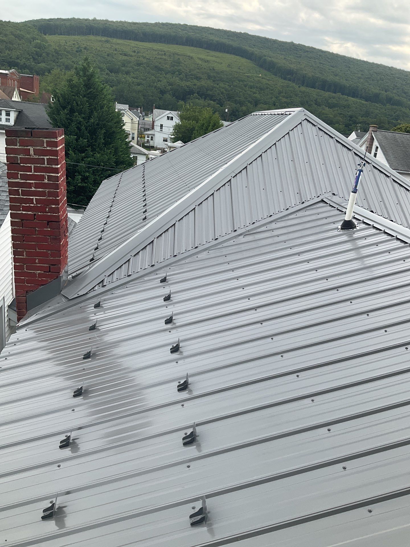 Charcoal Metal Roof & Blue Siding — A Refreshing New Look by Esh Builders