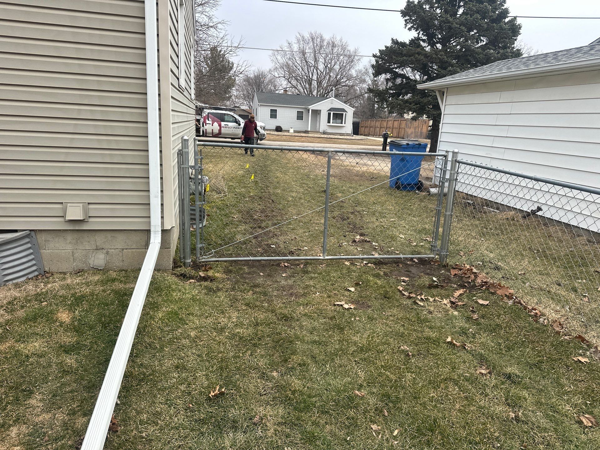 Galvanized Chain Link Fence and Vinyl Gate Installation in Washburn by Perfect Picket Fence and Stain