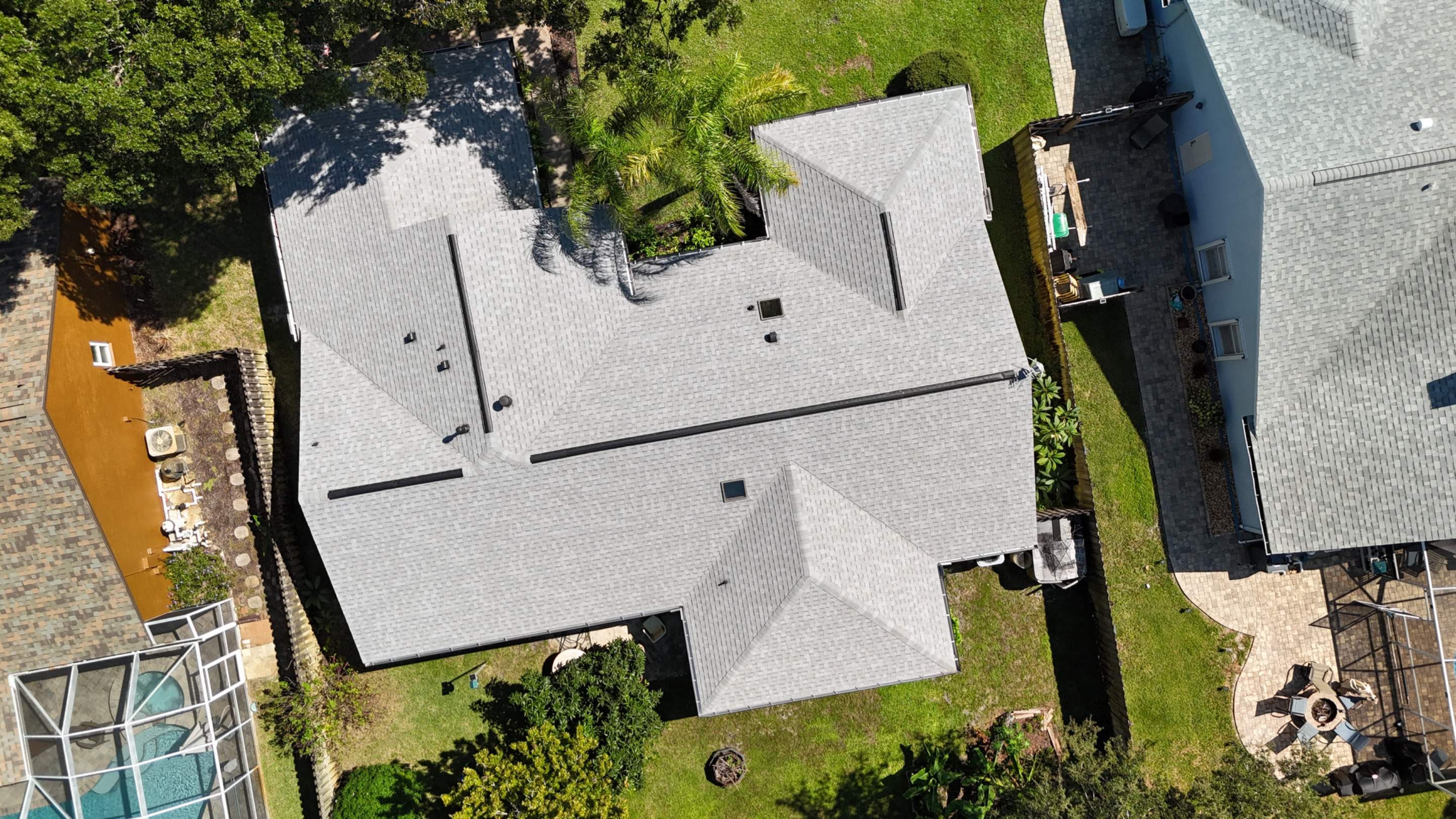 Comprehensive Roof Replacement w/ Old English Pewter Shingles & Black Ridge Vent in Melbourne by Wiedmann Construction & Roofing
