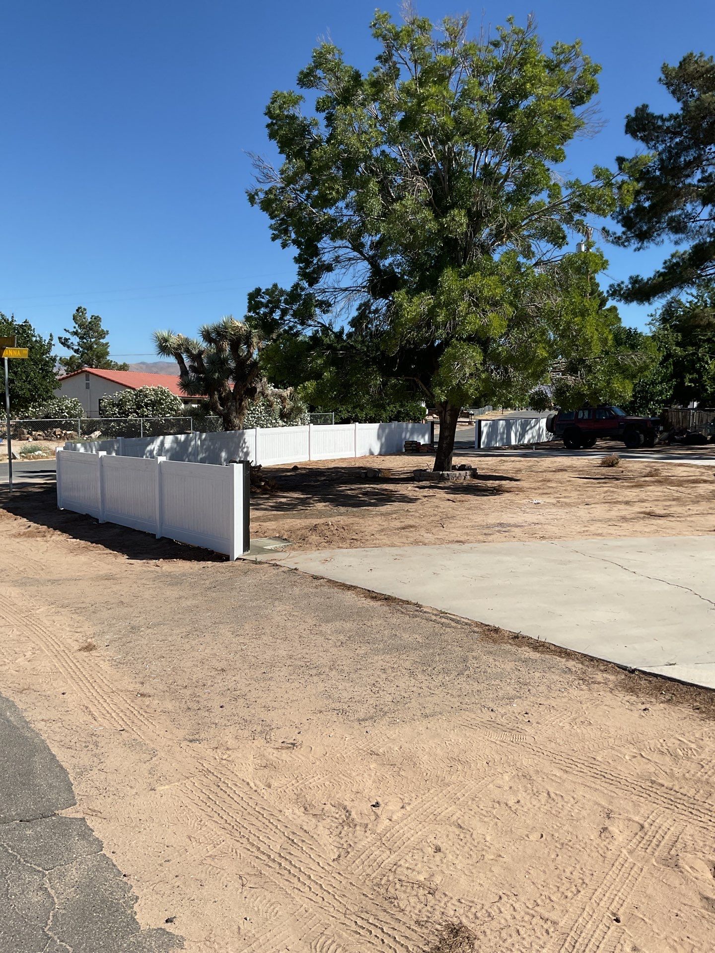 4ft White Vinyl Fence with Solar Power Motorized Gate by Fence Guys Inc.