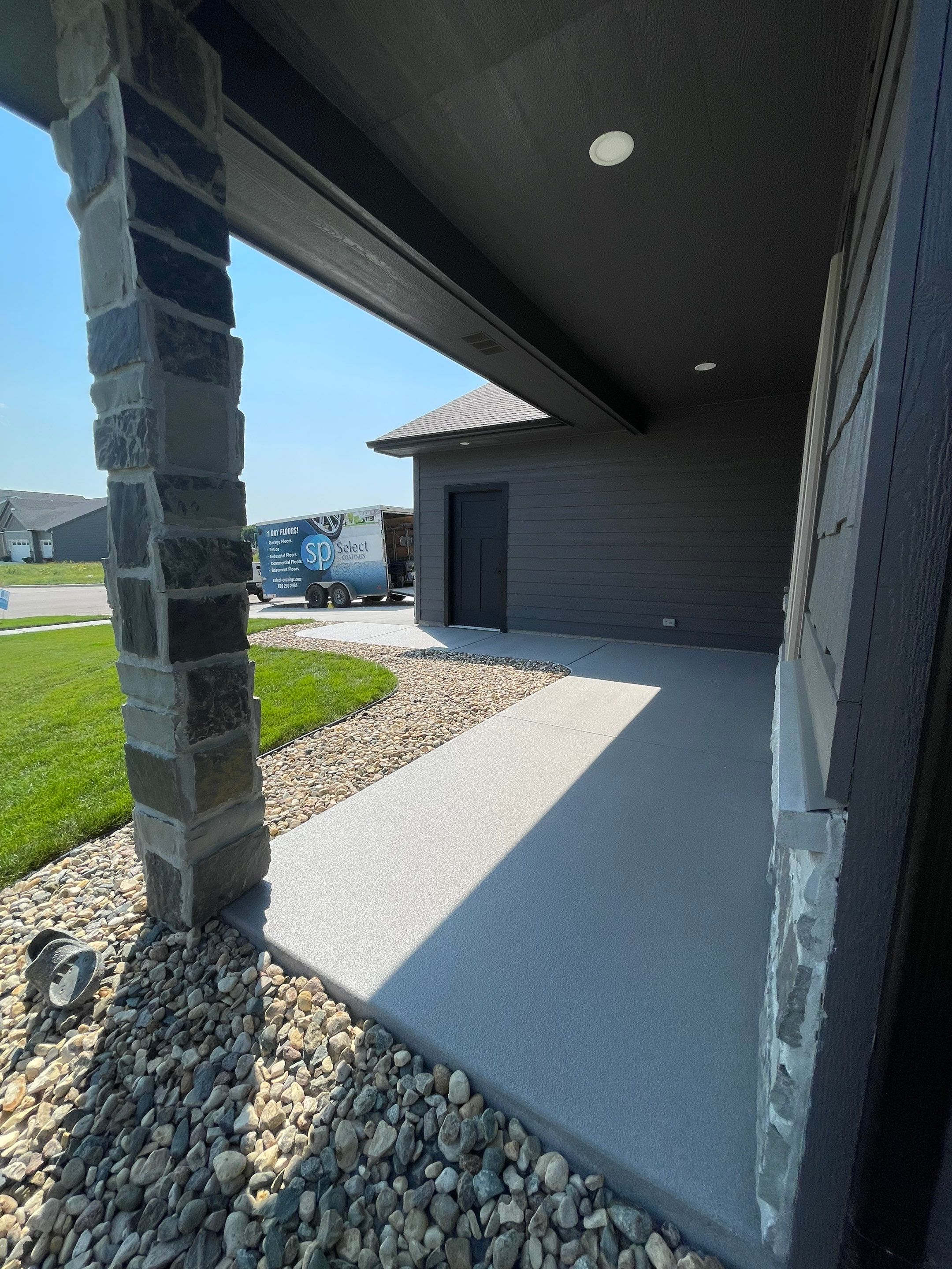 Sioux Falls Residential Concrete Patio and Walkway Coating by Select Painting, Coatings & Garage Cabinets