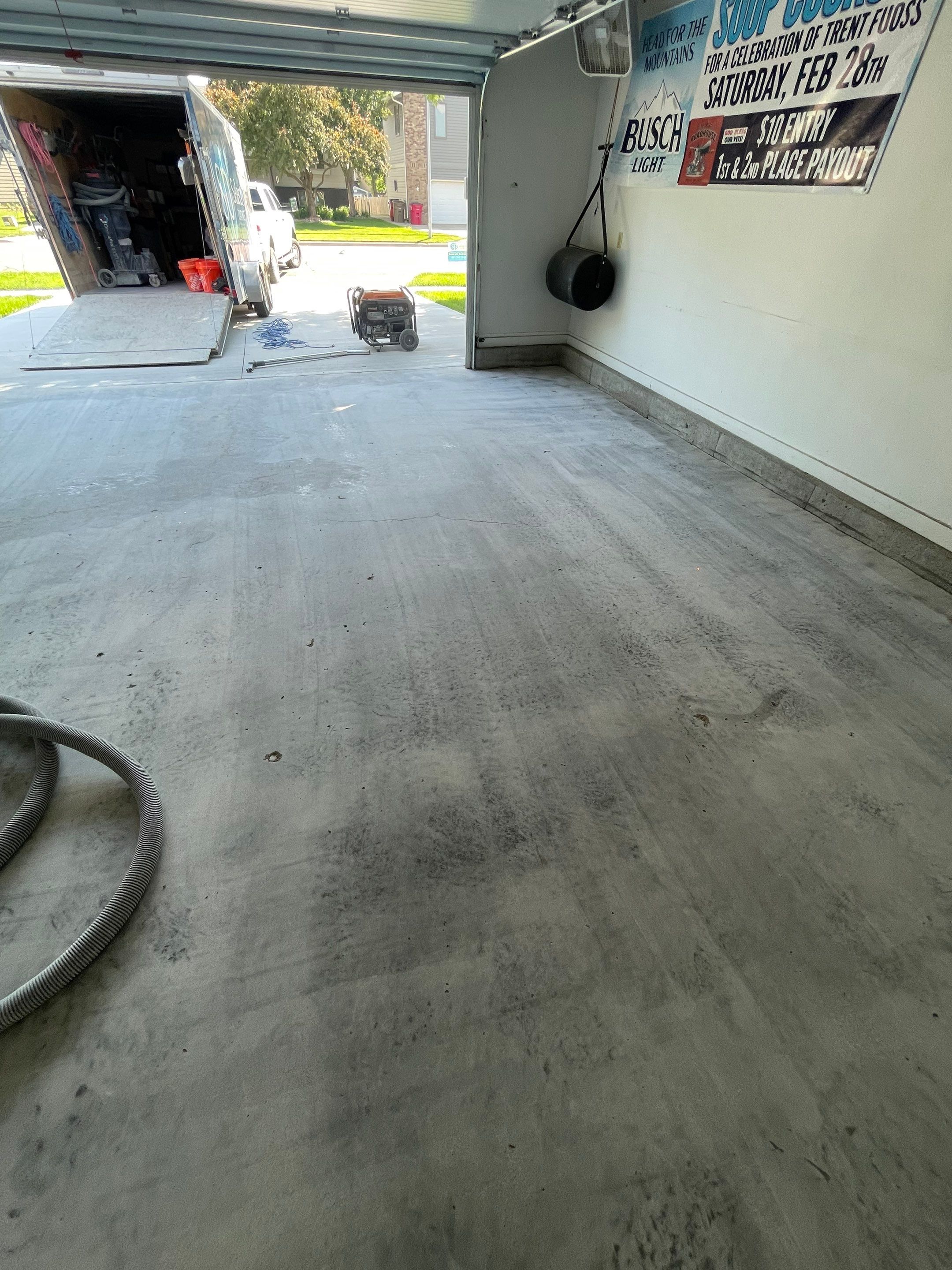 Residential Garage Floor Coating with Feather Grey Finish in Sioux Falls by Select Painting, Coatings & Garage Cabinets