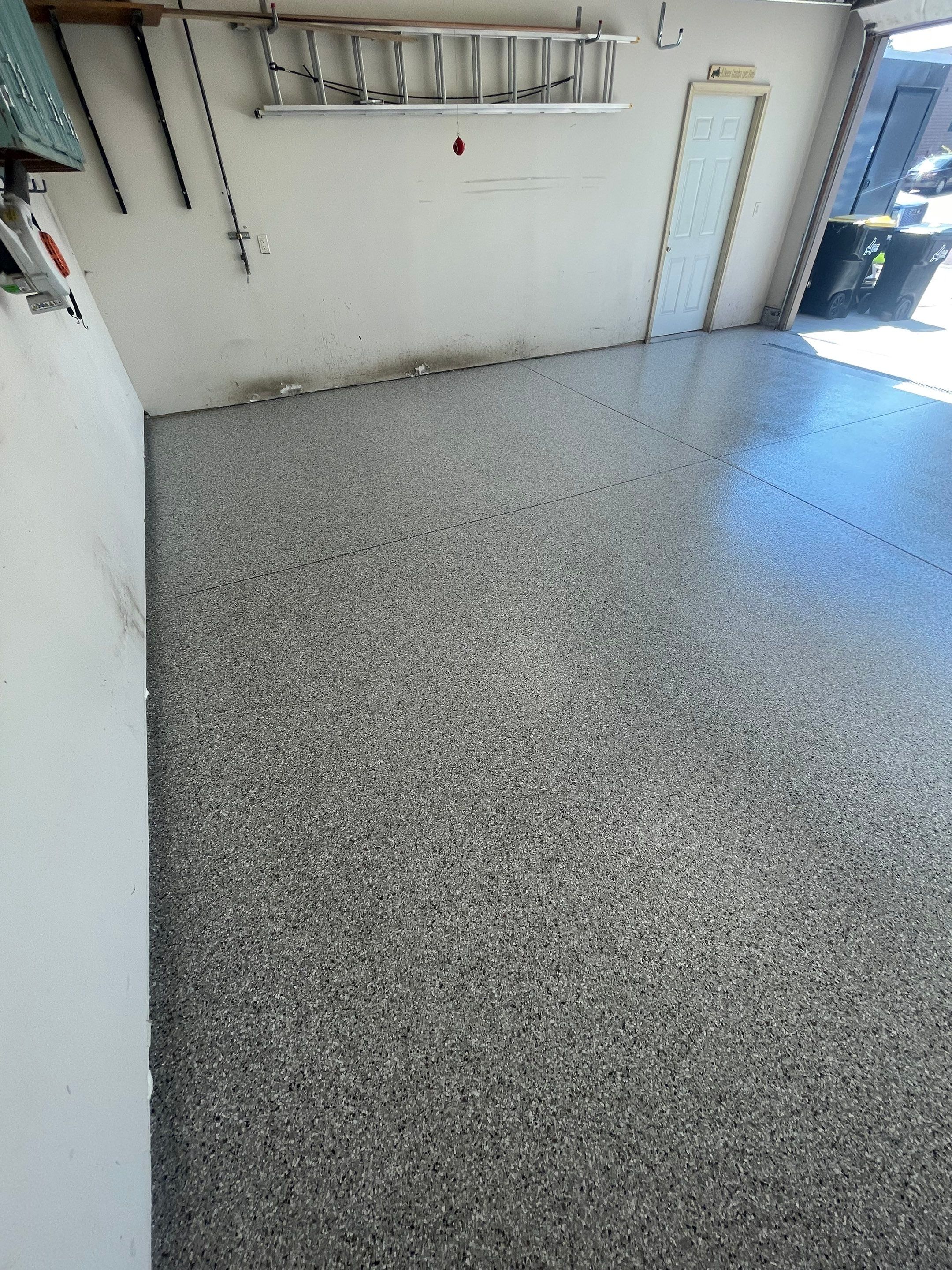 Multi-Stall Garage Floor Coating Installation in Sioux Falls by Select Painting, Coatings & Garage Cabinets