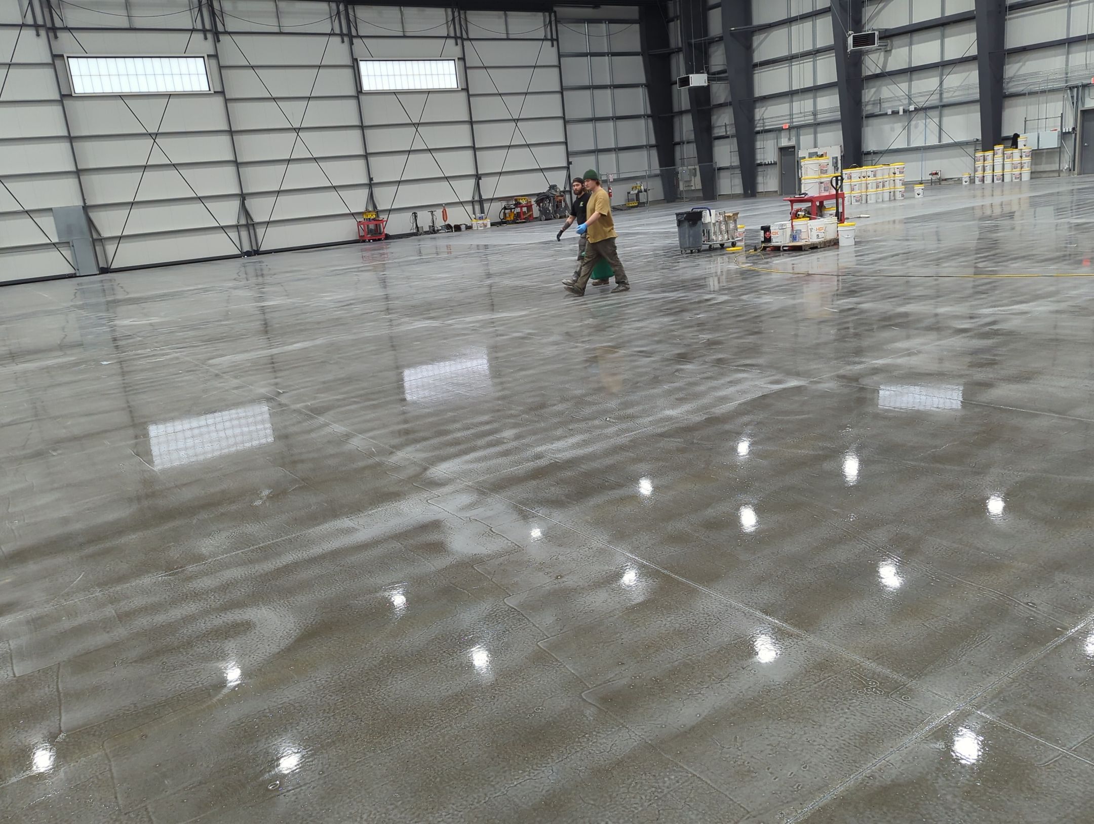 Airplane Hanger using Light Grey Commercial Penntek Epoxy by Croc Coatings, LLC