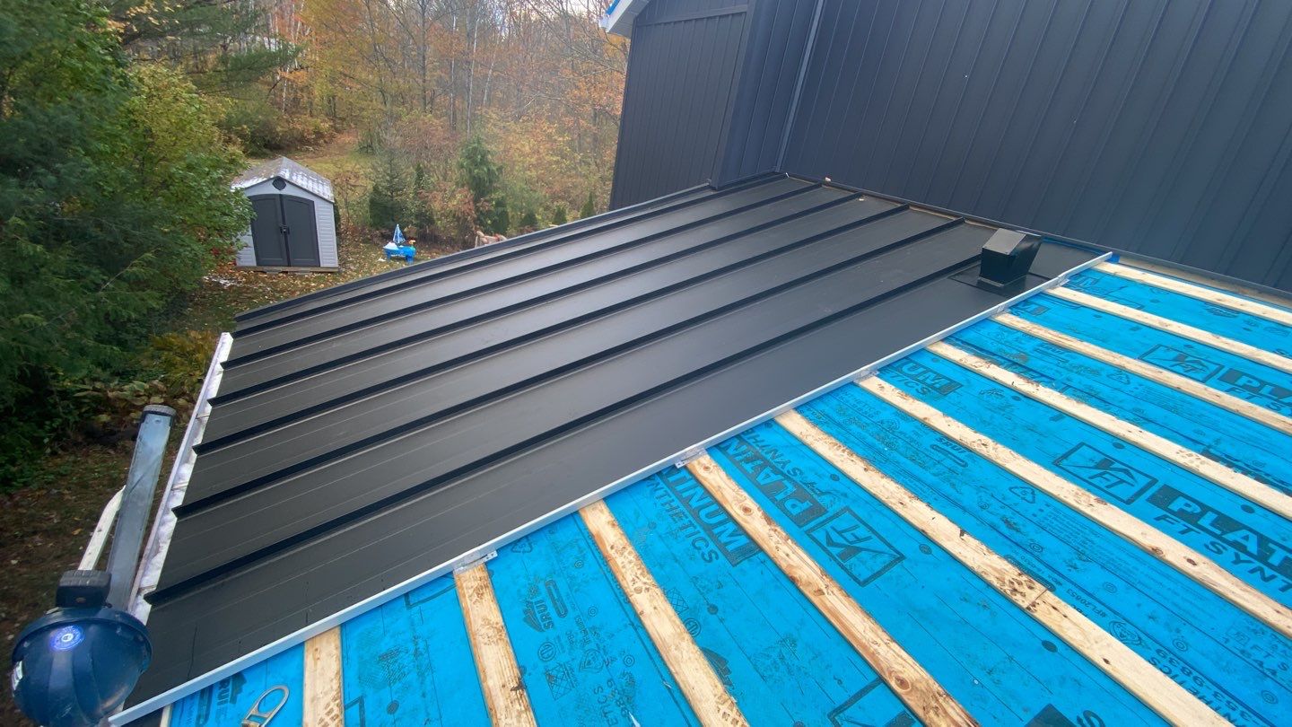 Residential Roofing Installation using 16" Standing Seam Panels by Jay Carter Roofing & Sheet Metal