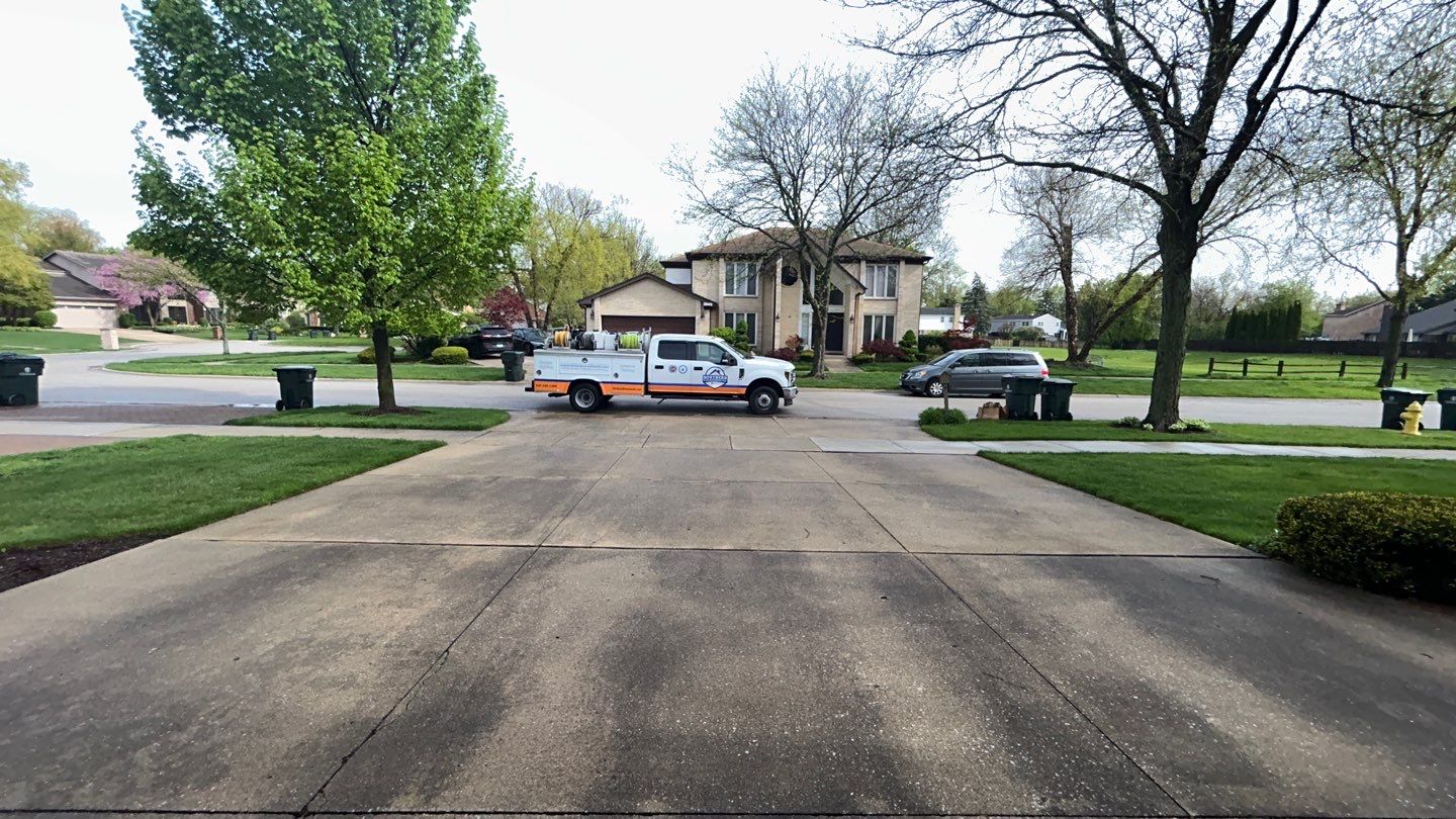 concrete patio and driveway cleaning by Northern Power Washing LLC.