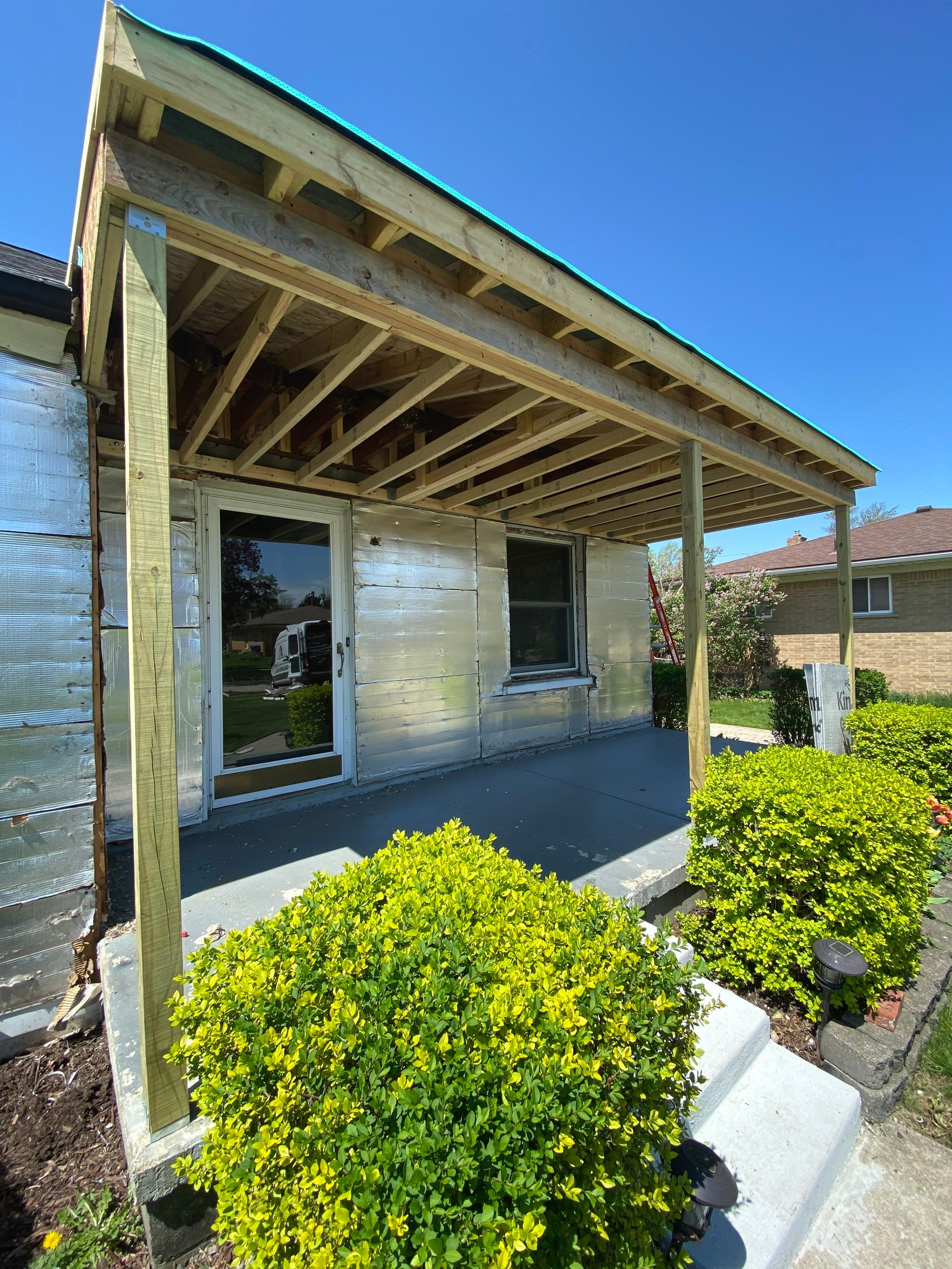 Siding Replacement using CertainTeed Monogram vinyl in Colonial White & Front Porch Remodel by Bloomfield Construction & Restoration