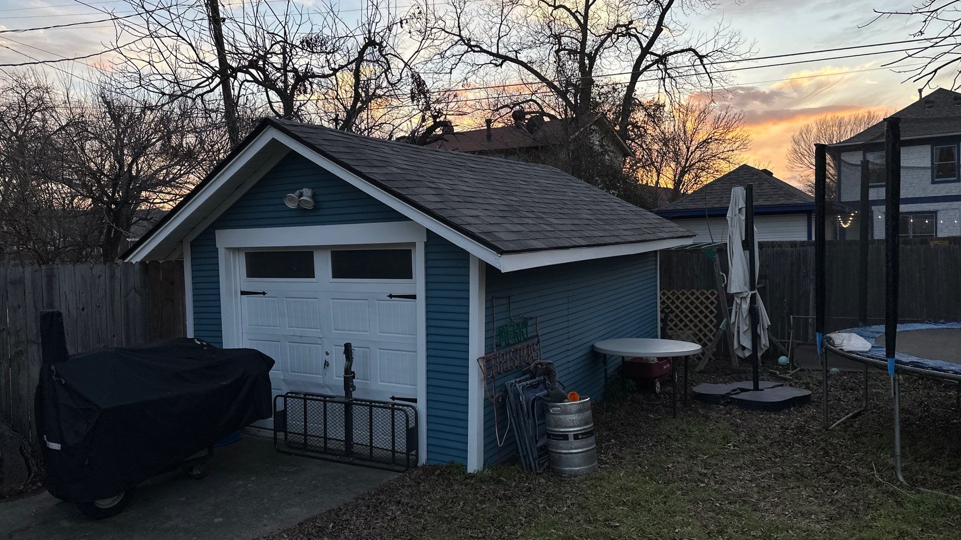 Blue sliding/brick columns on the porch with Malarkey Storm Grey by Tejas Roofworks + Restoration