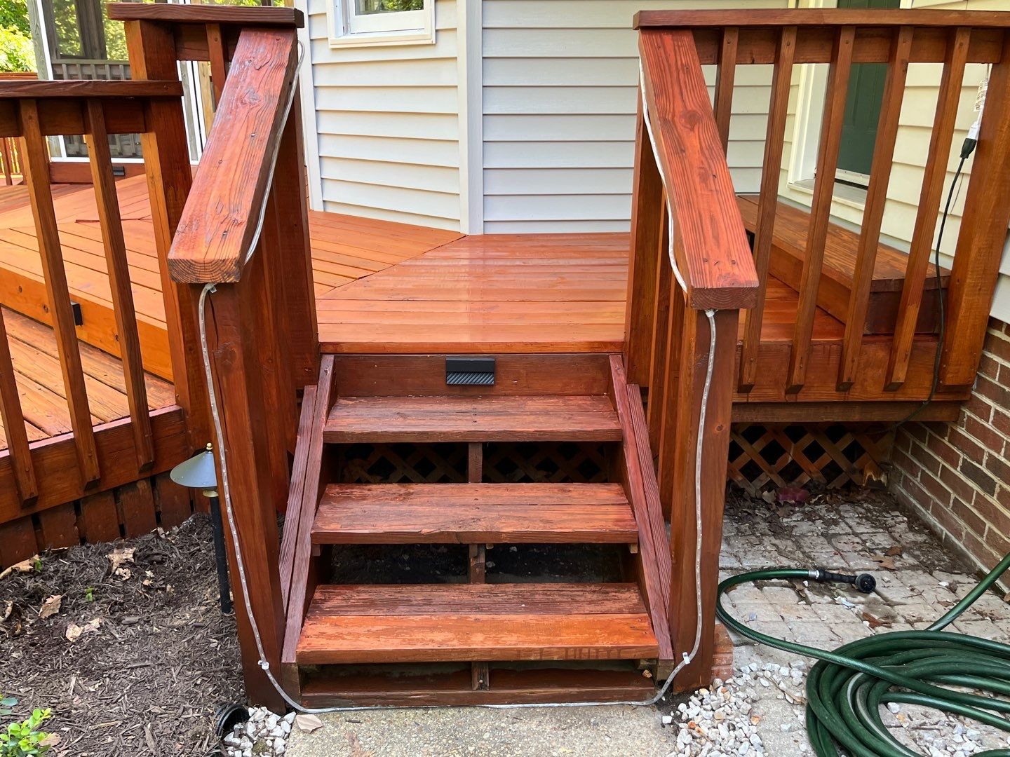 Triple deck re-staining by AKK Painting LLC