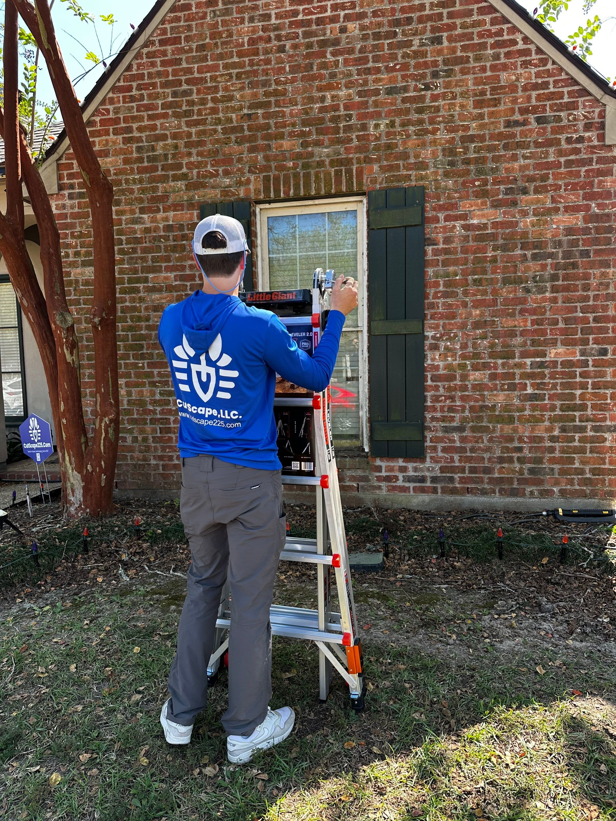 HOLIDAY LIGHTING using ROOFLINE PERIMETER LIGHTING: HALLOWEEN THEME WITH ORANGE AND PURPLE BULBS by CutScape, LLC.