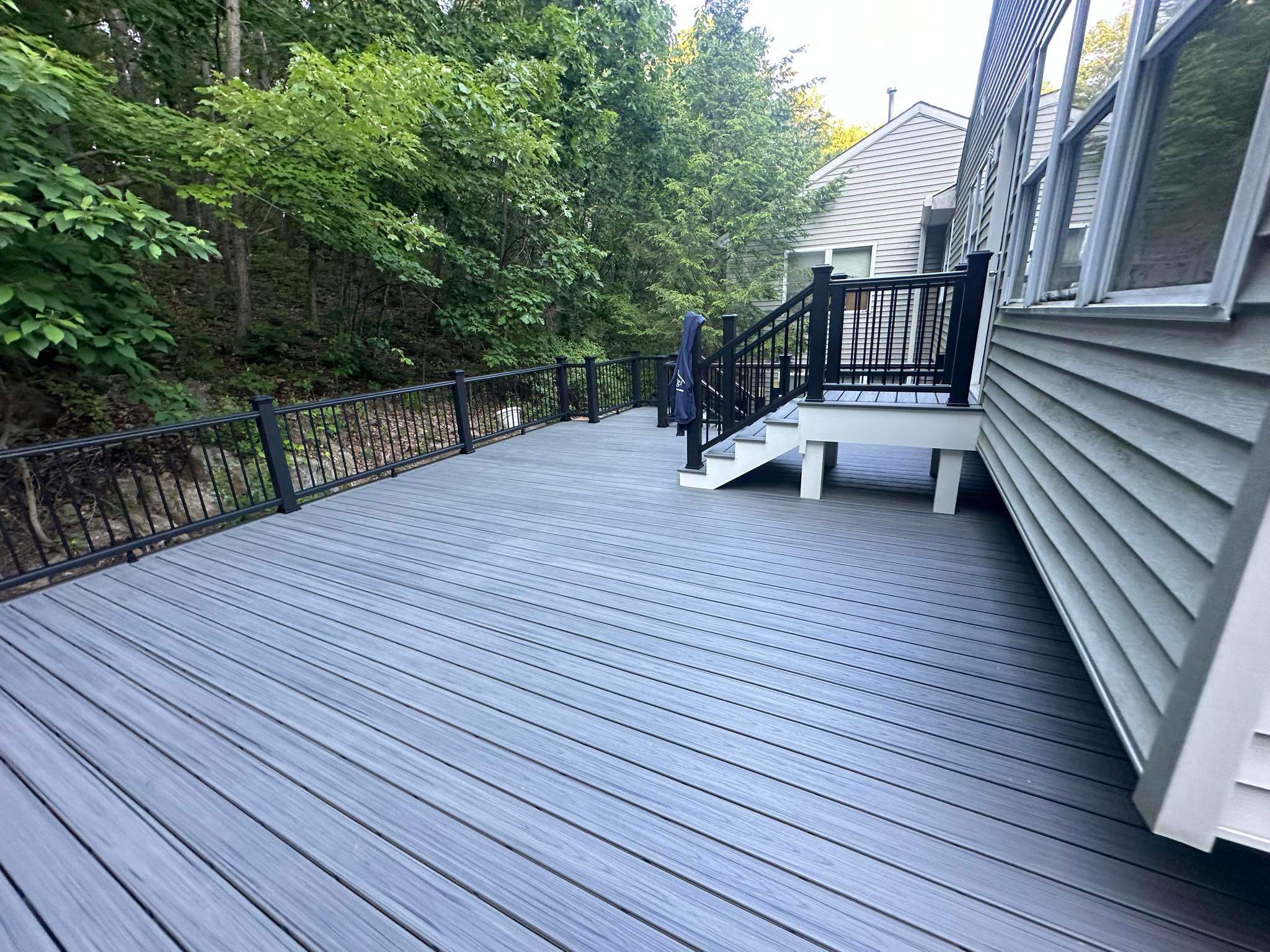 Pool Deck replacement, Trex Tropical Island Mist , Black Transcend railing. by DiGiorgi Roofing and Siding Inc