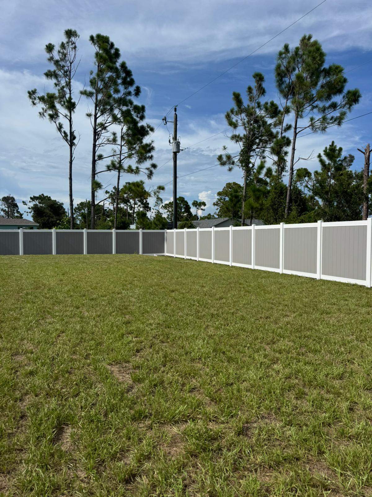 Two-Tone Vinyl Privacy Fence Installation in Port Charlotte by True Fence LLC