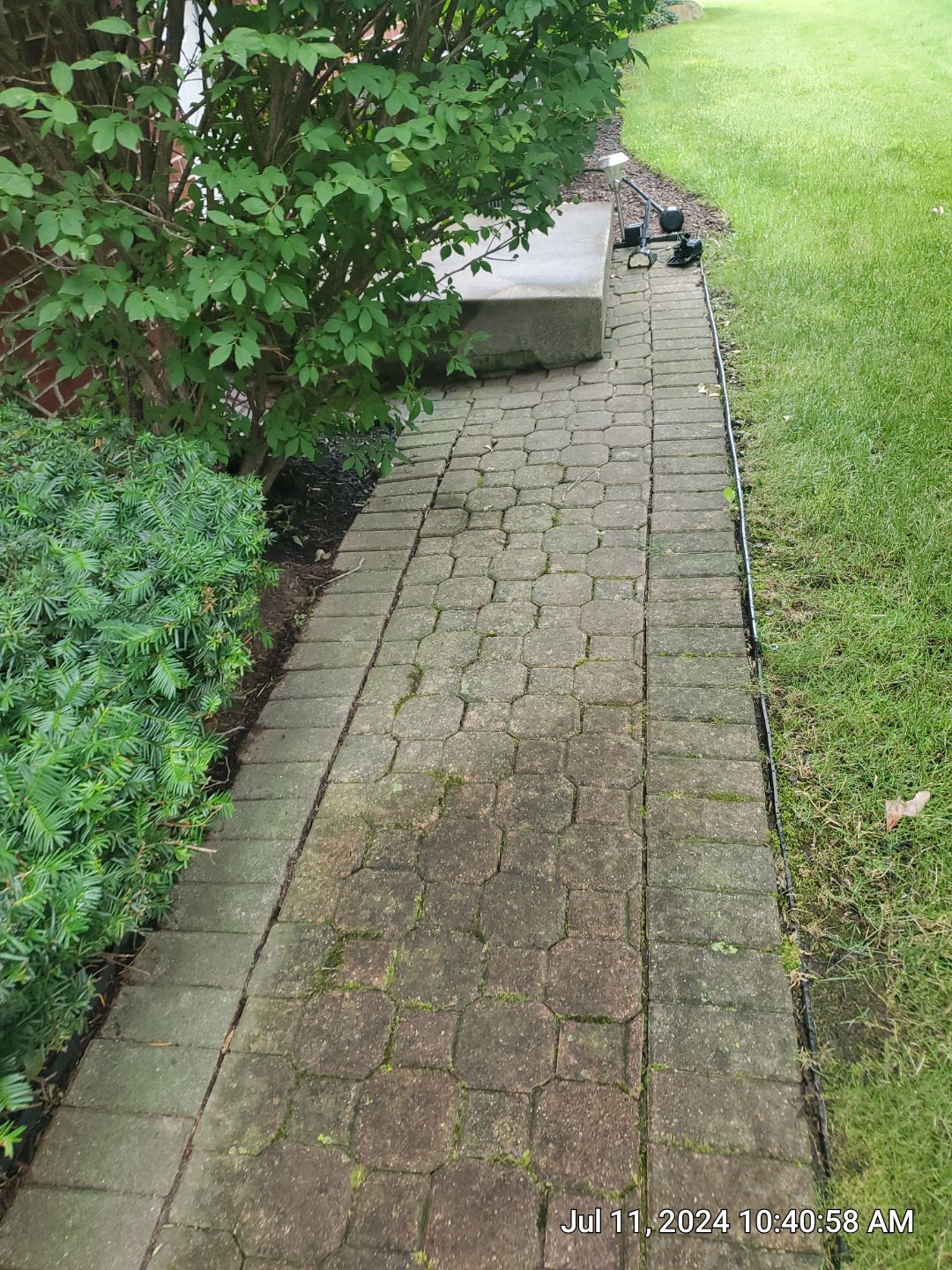Brick paver repair, clean and seal by Northern Power Washing LLC.