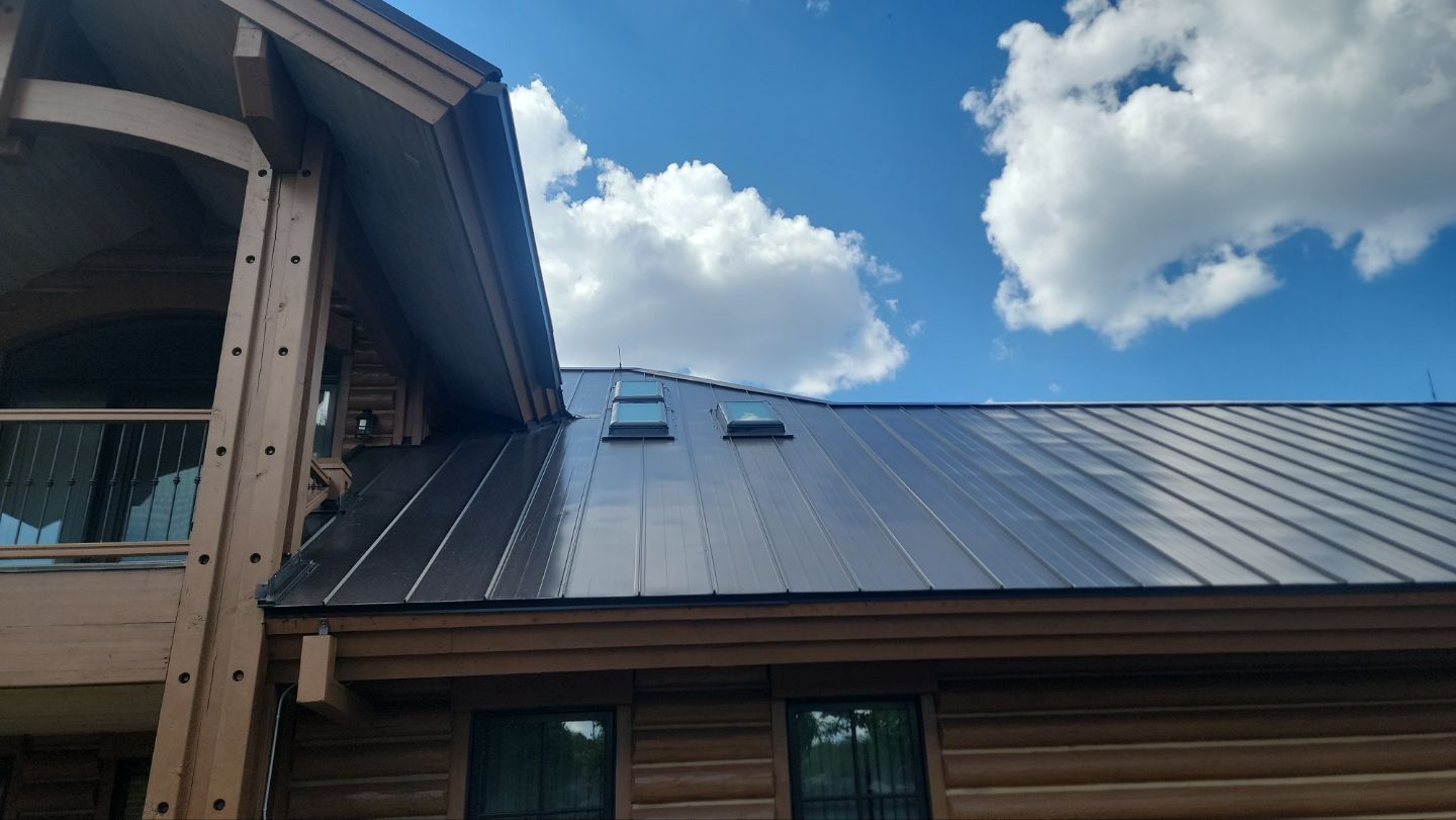 Standing Seam Metal Roof Replacement After Snow Damage by ASAP Roofing & Restoration