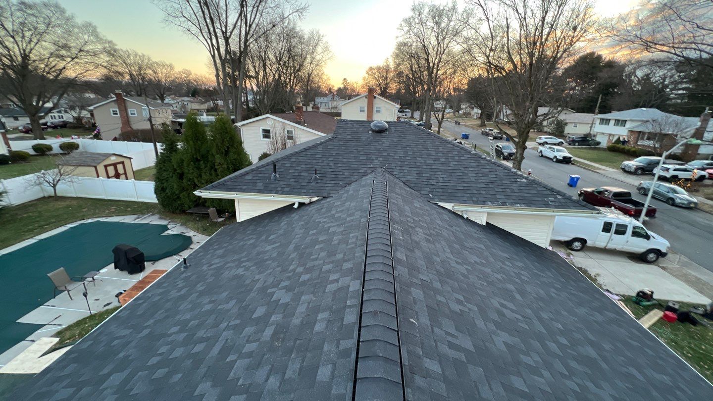 Onyx Black Shingles by Reimagine Roofing