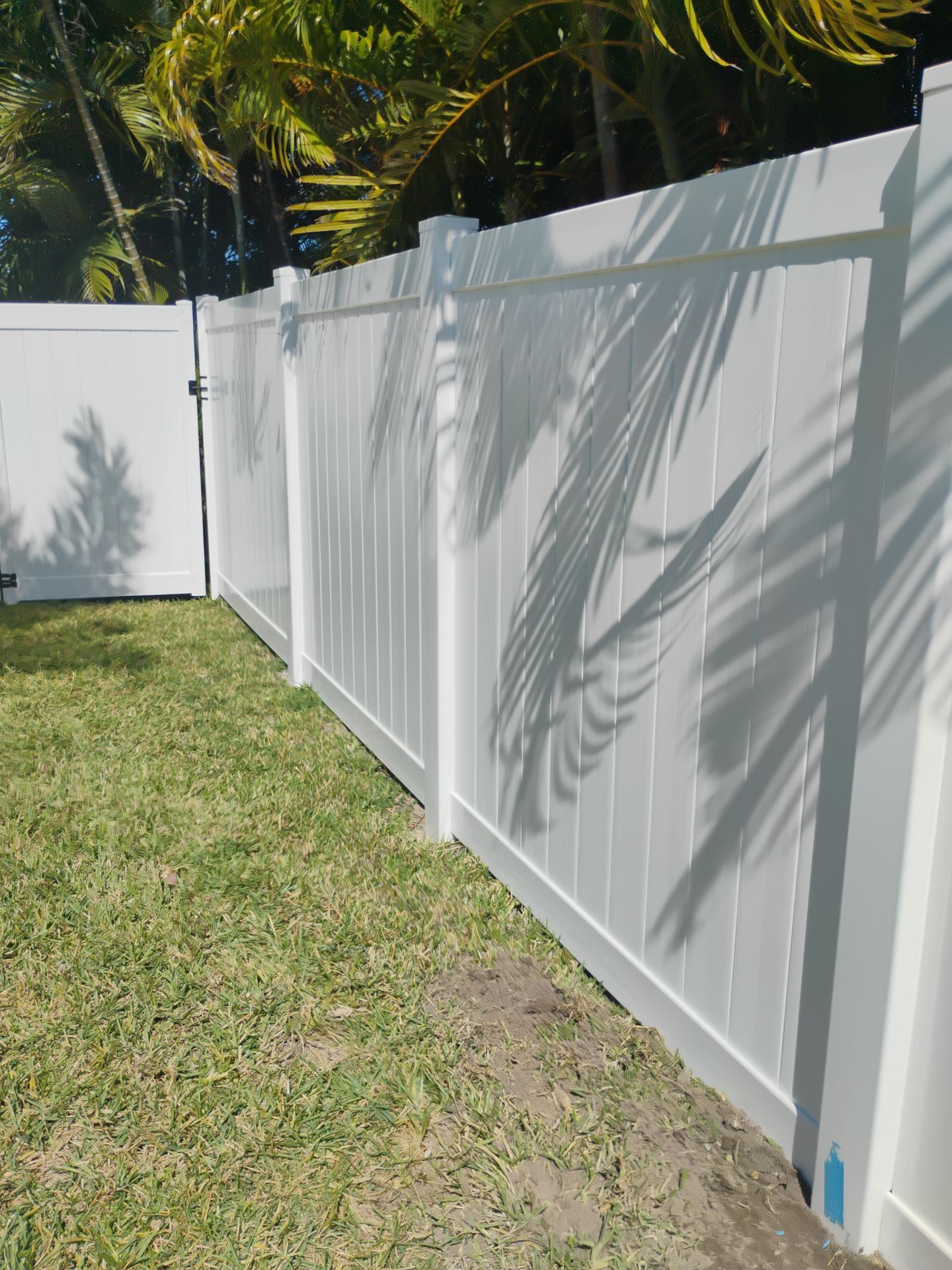 White Vinyl Privacy Fence and Double Gate Installation in Fort Myers by True Fence LLC
