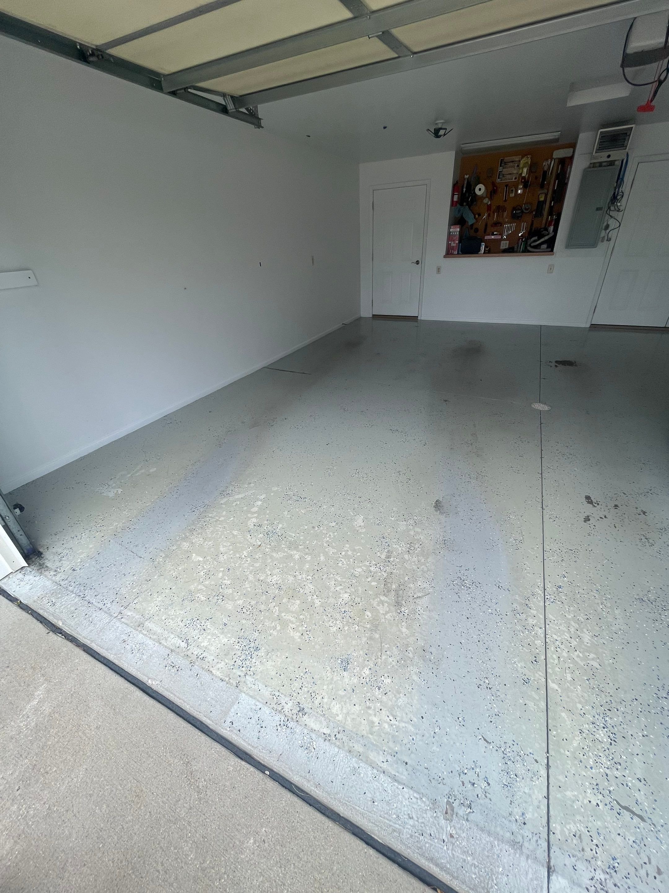 Coyote Flake Garage Floor Coating in Worthington, Minnesota by Select Painting, Coatings & Garage Cabinets