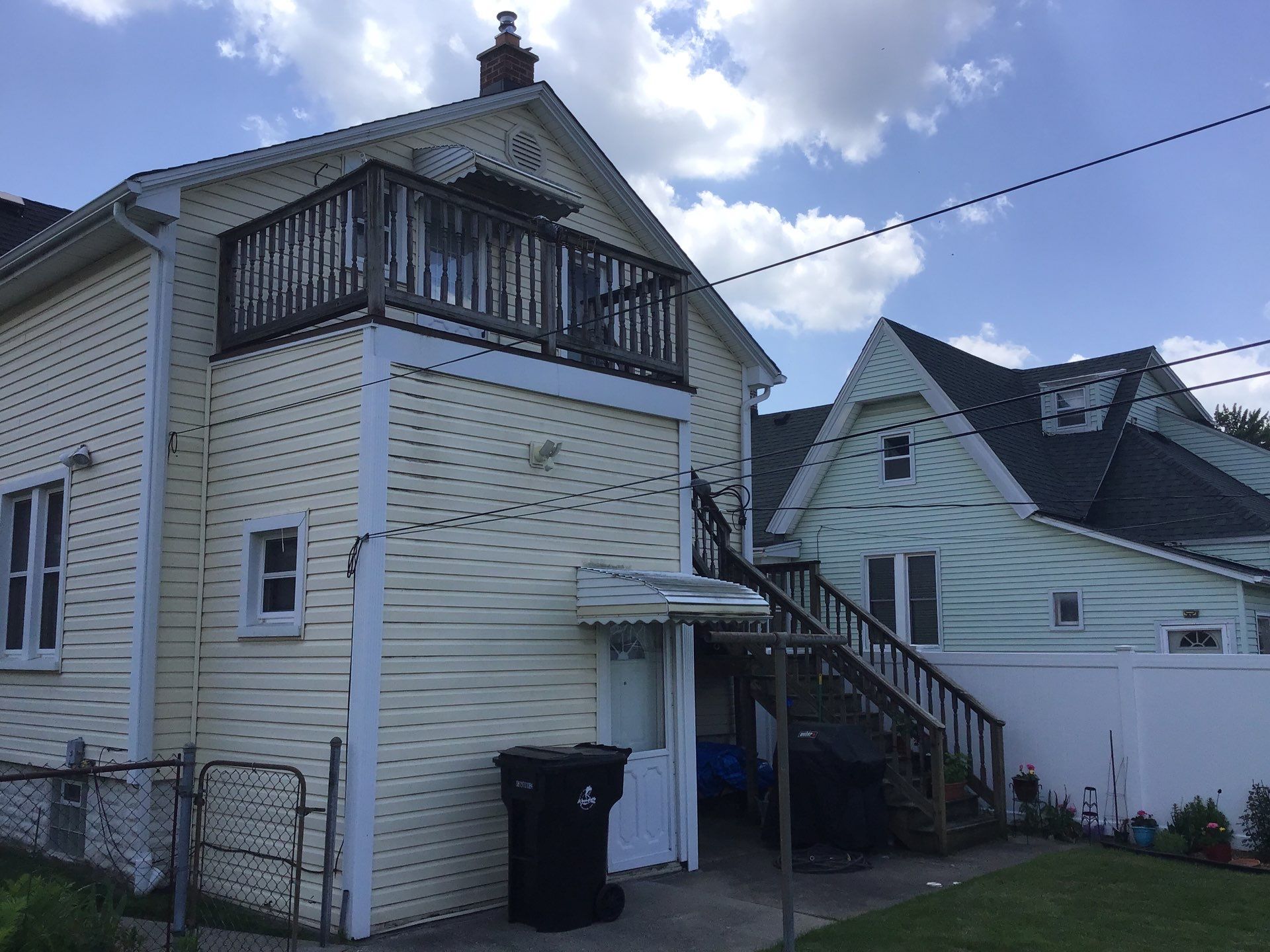 Rebuild balcony flat roofing TREX decking stairway and Railings in Wyandotte, MI by Northwest Construction 
