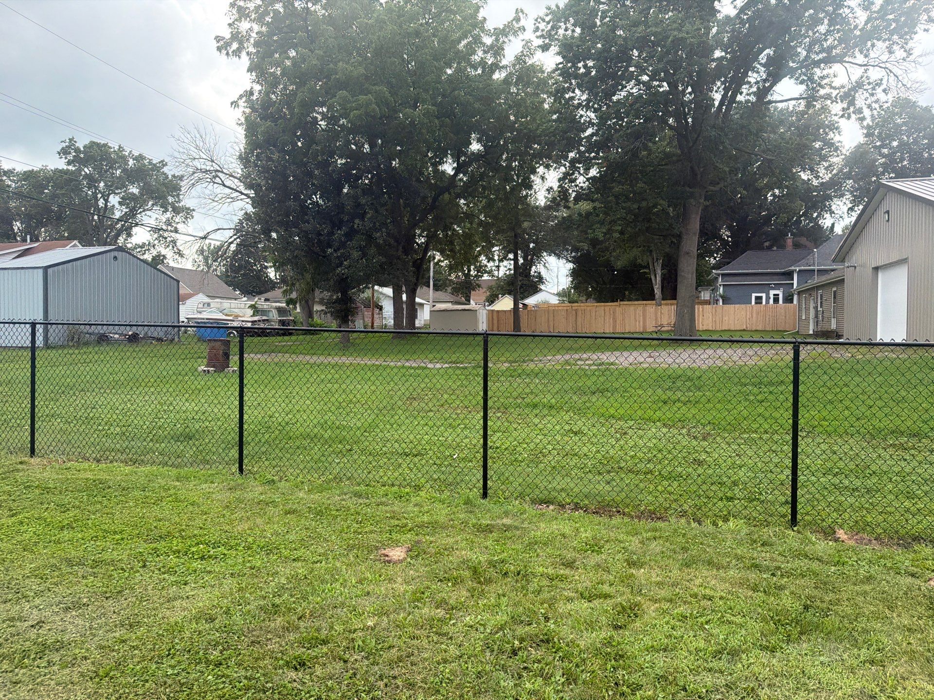 Residential Black Chain Link Fence Installation in Reinbeck by Perfect Picket Fence and Stain