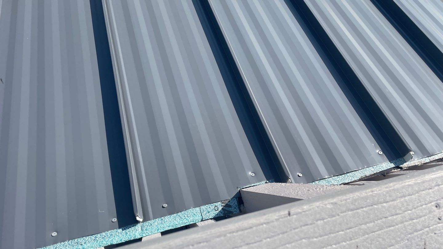Residential Roofing Installation using Gulf Coast Metals Gulf Seam Panels by Four Peaks Roofing