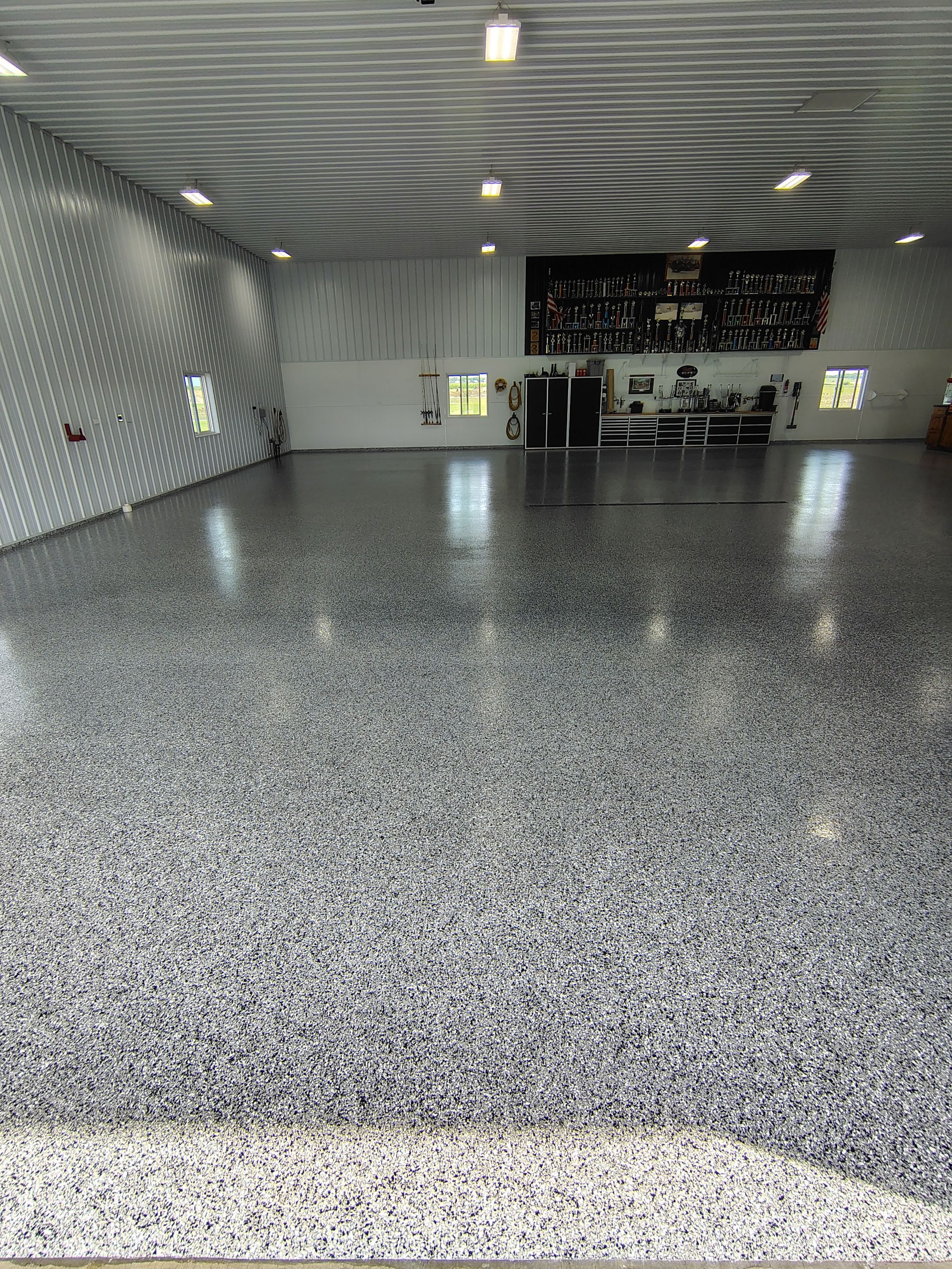 Multi-Stage Concrete Floor Coating for Egan Shop and RV Storage by Select Painting, Coatings & Garage Cabinets