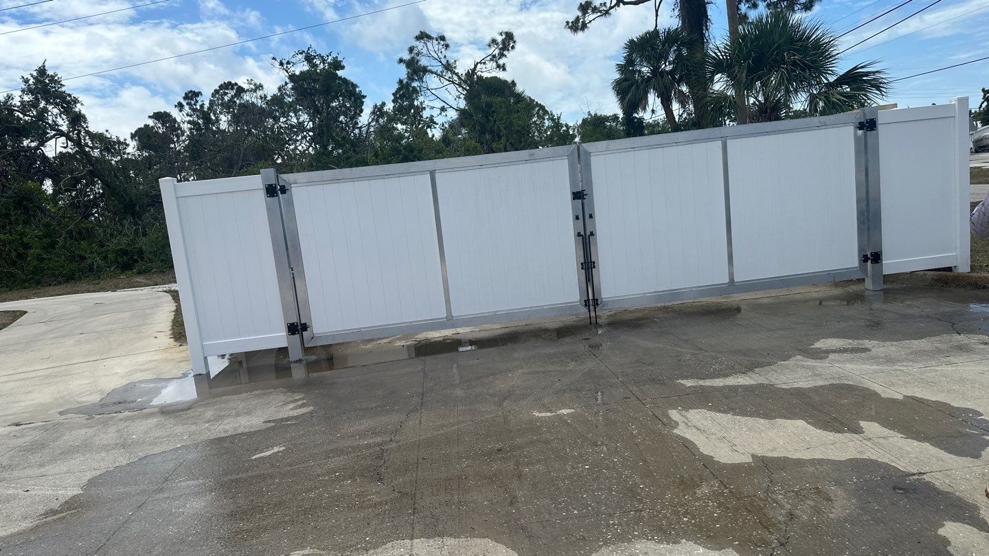 Commercial Chainlink and Vinyl Fence With Aluminum Framed Gates On Dumpster Enclosure by Asap fence and gates, LLC