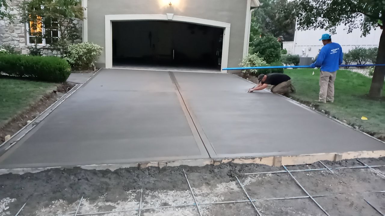 New Driveway and Sidewalk by LAND ESCAPES LLC