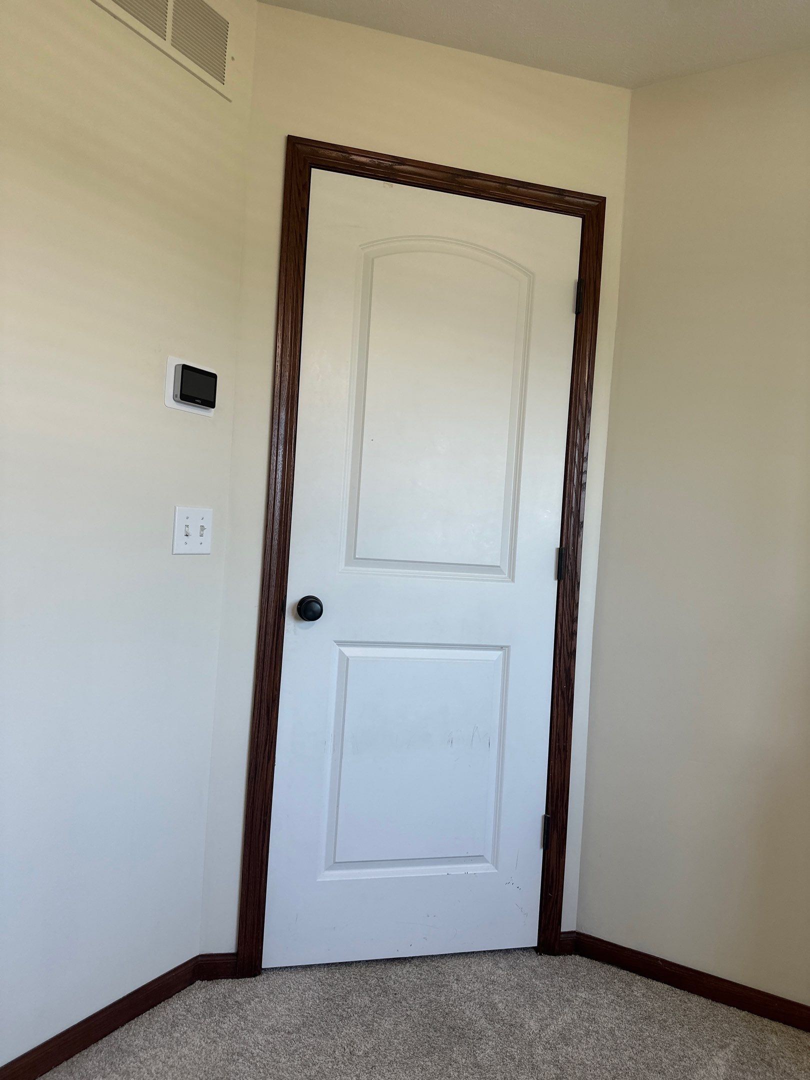 Interior White Door and Dark Wood Trim Installation in Lincoln by CompanyCam Sales Demo