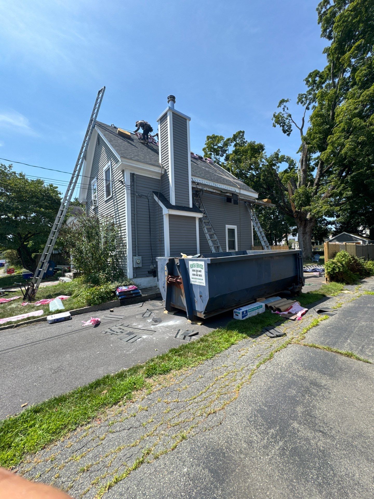 Full Roof Replacement + Custom Gutter Install | Onyx Black Finish by Mighty Dog Roofing of Greater Middlesex County