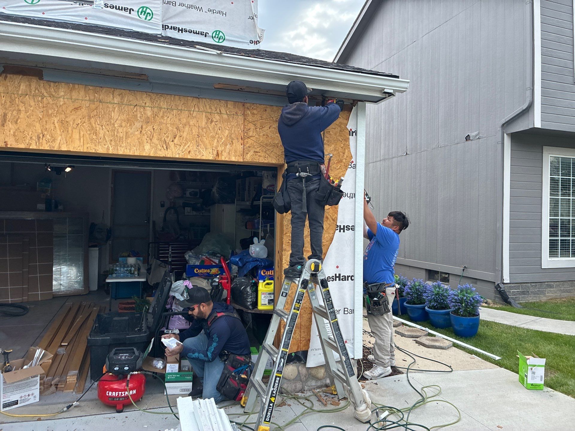 James Hardie Siding and Window Replacement with Arctic White Trim by Carps Complete Exteriors