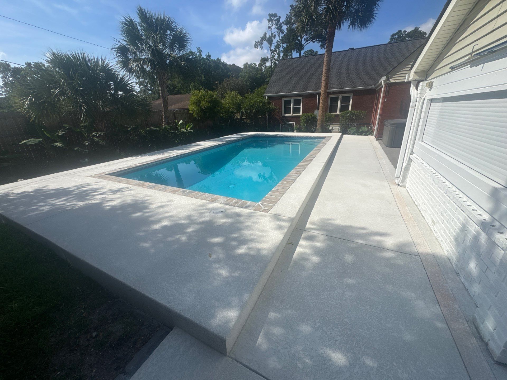 Savannah Pool Deck Replacement with Textured Concrete and Brick Coping by Lowcountry Scapes, LLC