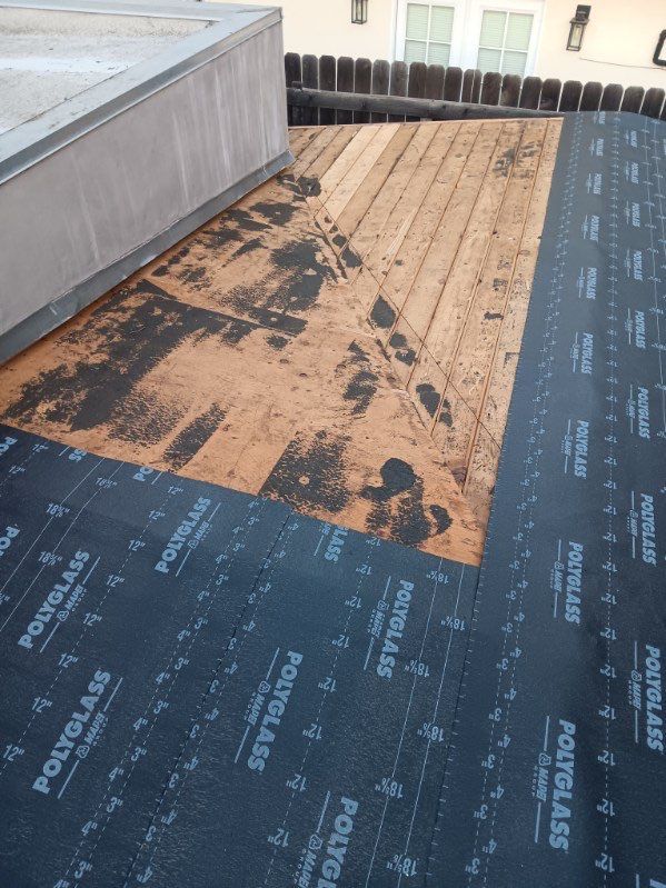 Residential Roofing Installation using Polyfresko® G Highly Reflective Modified Bitumen Cap Sheet by Hull Brothers Roofing