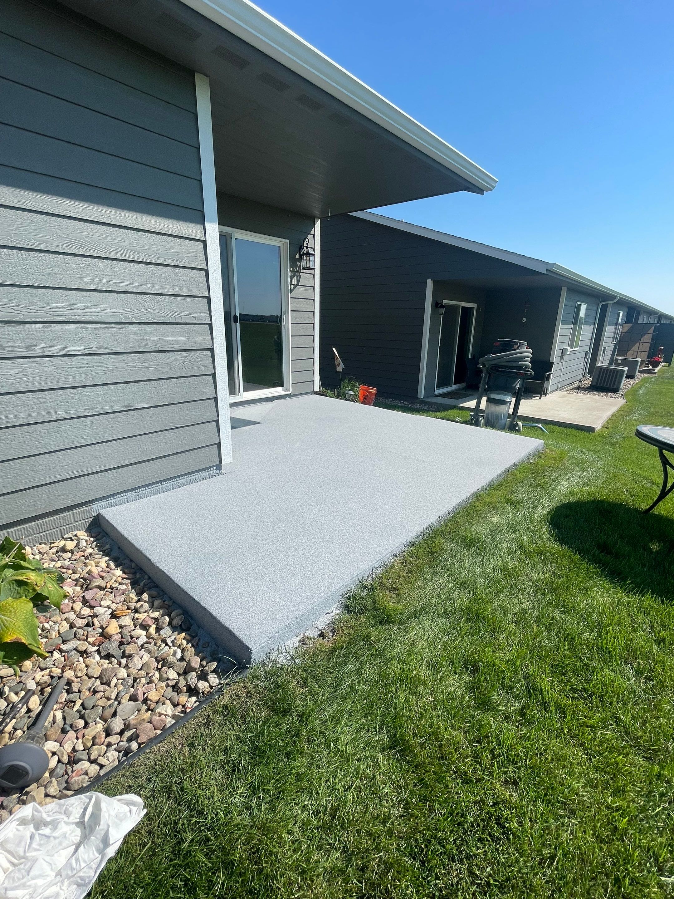 Starry Evening Concrete Patio Coating Installation in Tea by Select Painting, Coatings & Garage Cabinets