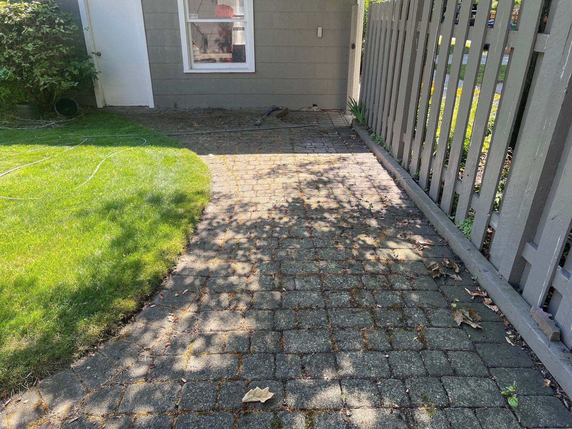 Brick paver cleaning and sealing by Northern Power Washing LLC.