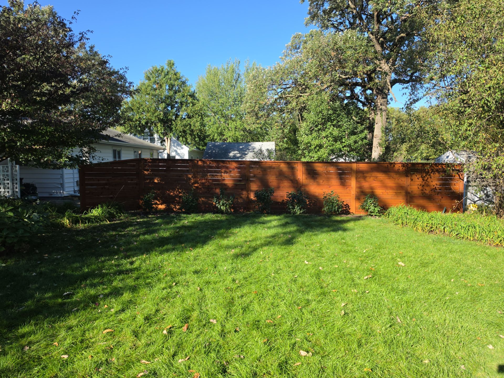 Stained Horizontal Cedar Wood Privacy Fence in Cedar Falls by Perfect Picket Fence and Stain