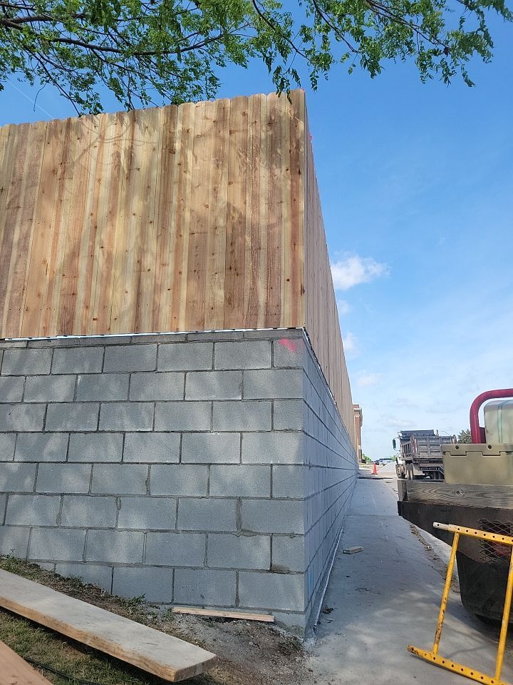 Cedar Fence using Cedar Pickets and Metal Poles by Clays Services Inc