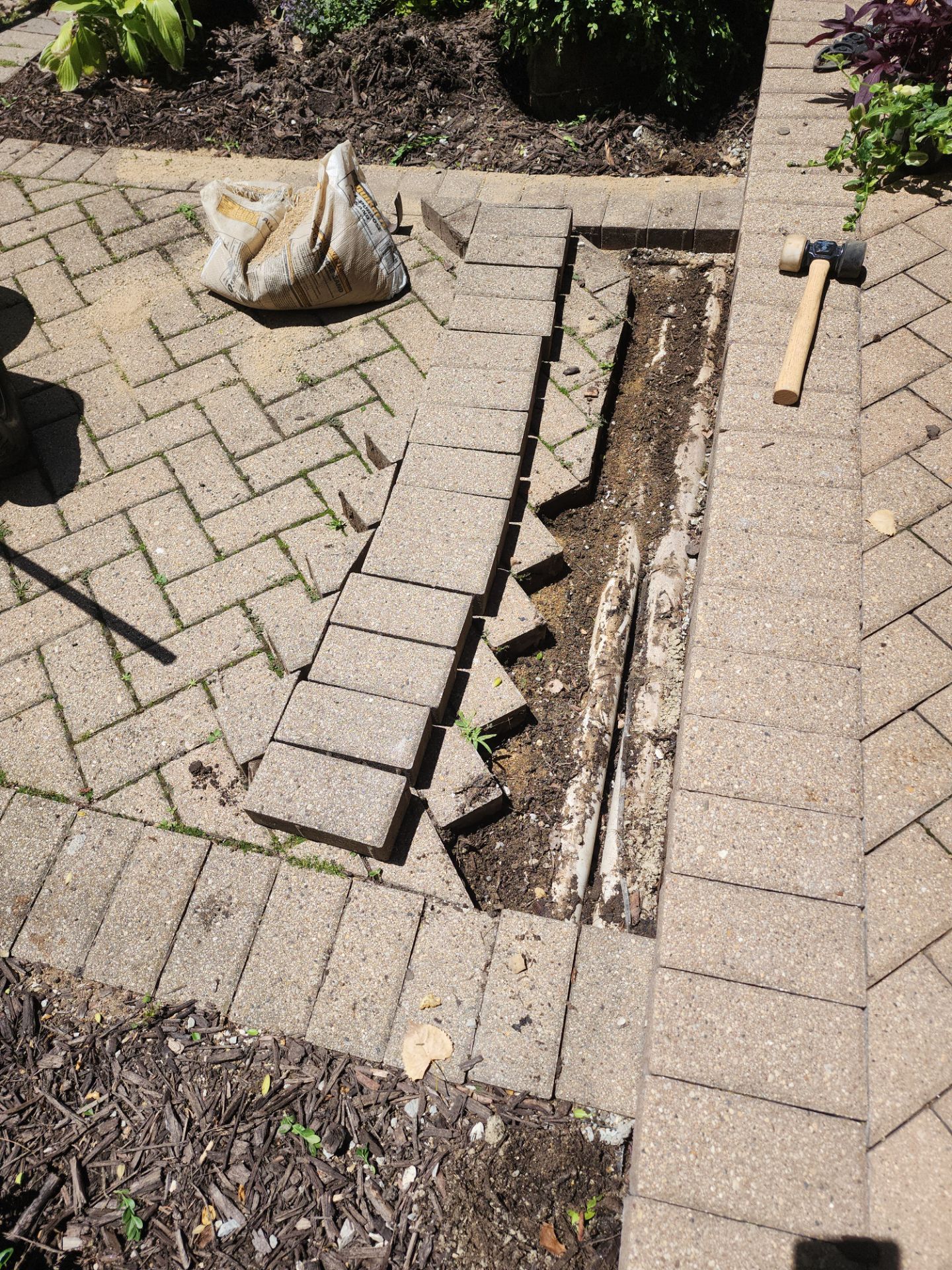 Brick paver repair, cleaning and sealing by Northern Power Washing LLC.