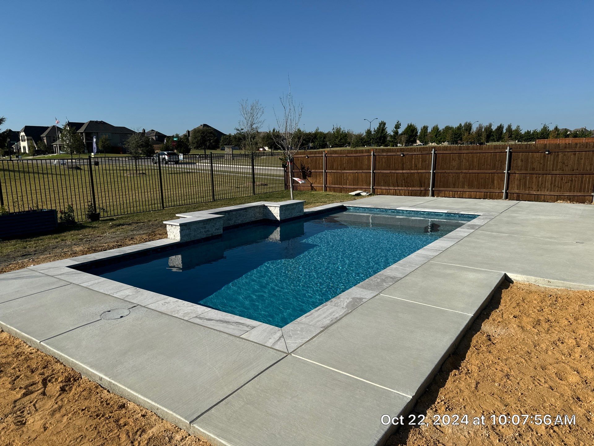 Modern Geometric Pool with Expansive Deck by Pinnacle Pools and Spas - DFW