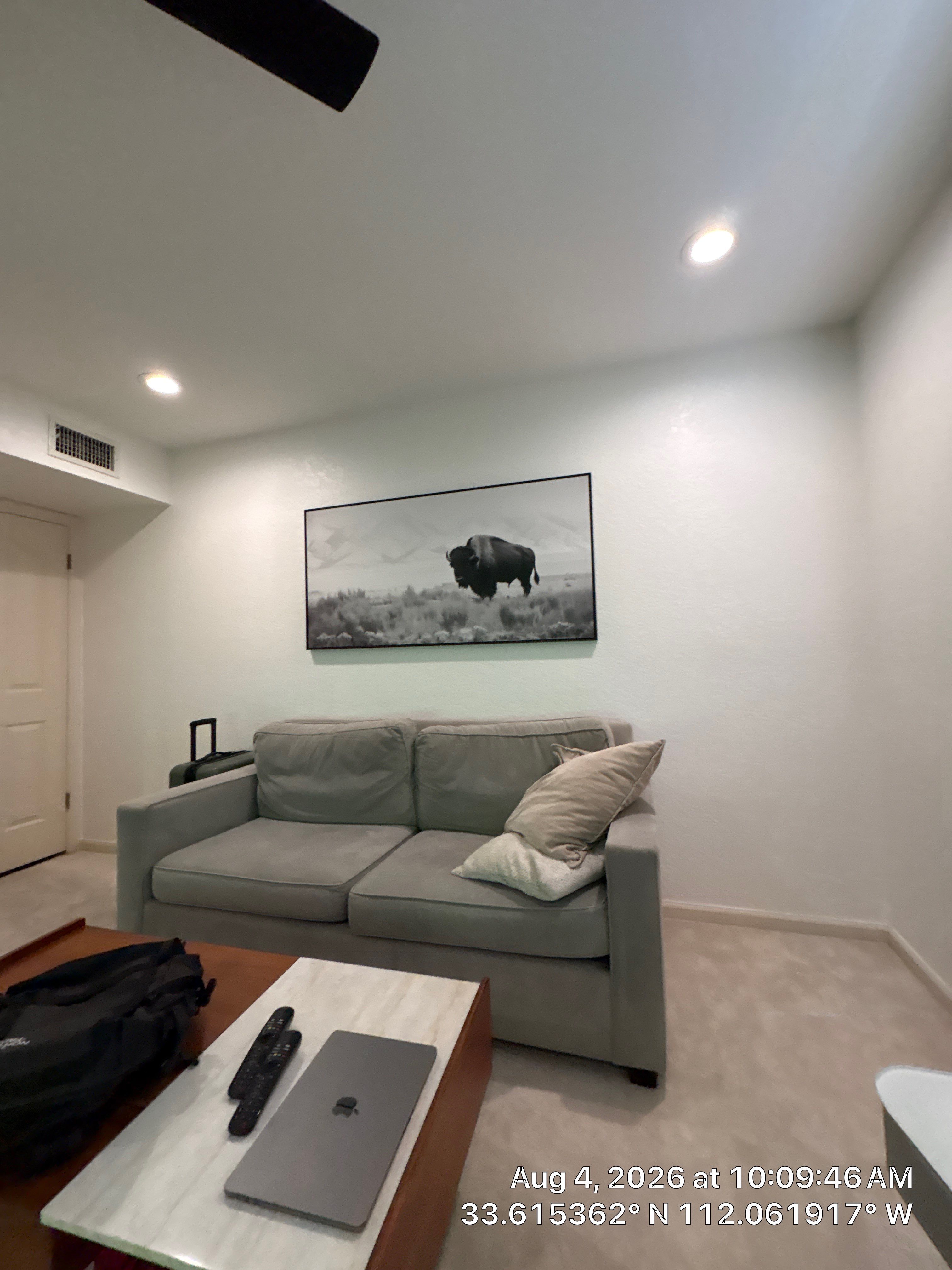 Custom Home Office Setup Featuring Arched Plantation Shutters and Accent Wall by CompanyCam Sales Demo