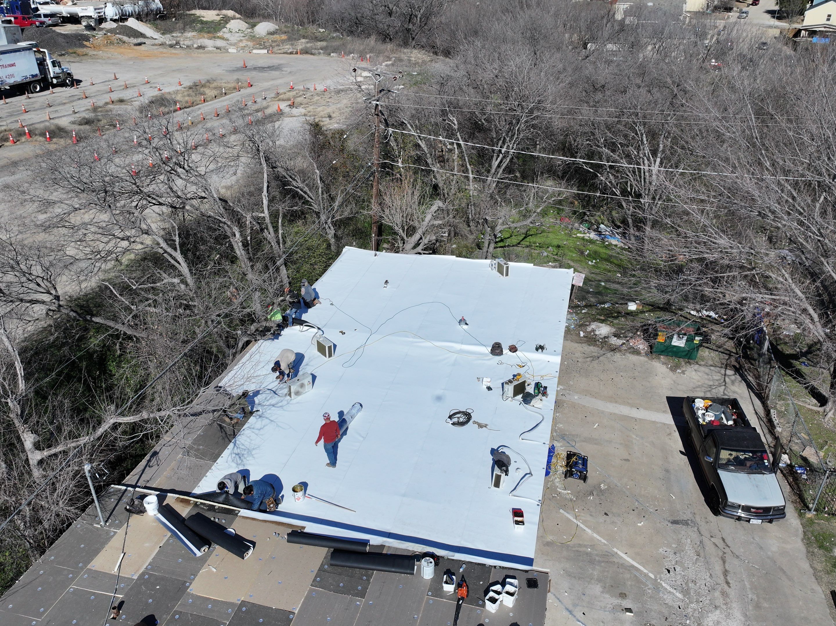 Commercial roofing overlay using GAF TPO over an old ballast roof by Becker Roofing and Exteriors
