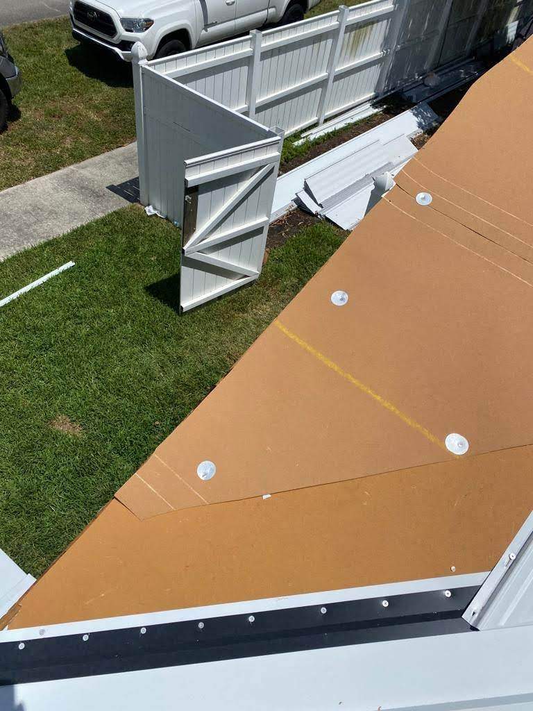 Standing Seam Metal & Flat Re-Roof using 1.5" Nail Strip 24ga Solar White Kynar Coated Standing Seam Metal Panels by Morton Roofing, Inc.