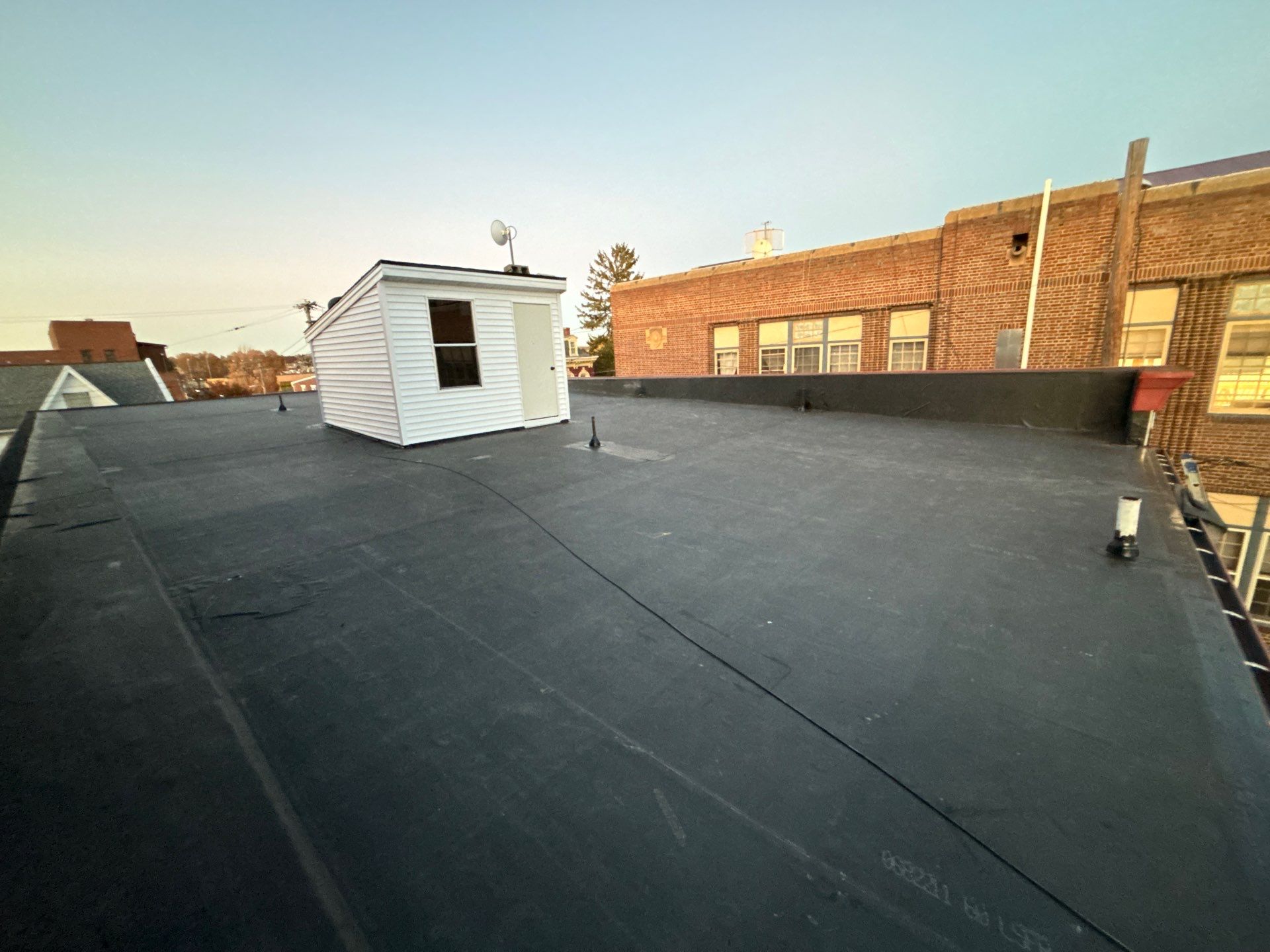Commercial Roofing Installation using EPDM Rubber Roofing by Roof Ninja LLC 
