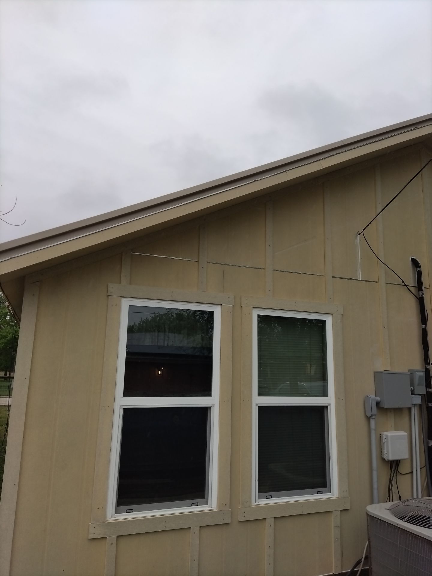 Vinyl to Hardie by Bayfront Roofing and Construction