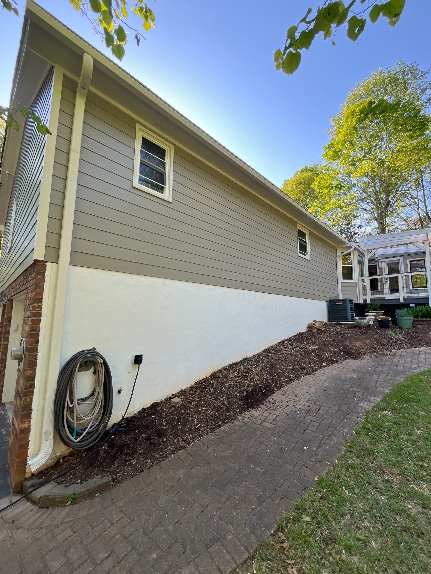 Window, Siding, & Rotten Wood Replacement with Exterior Painting in Woodstock, GA by Nelson Exteriors 
