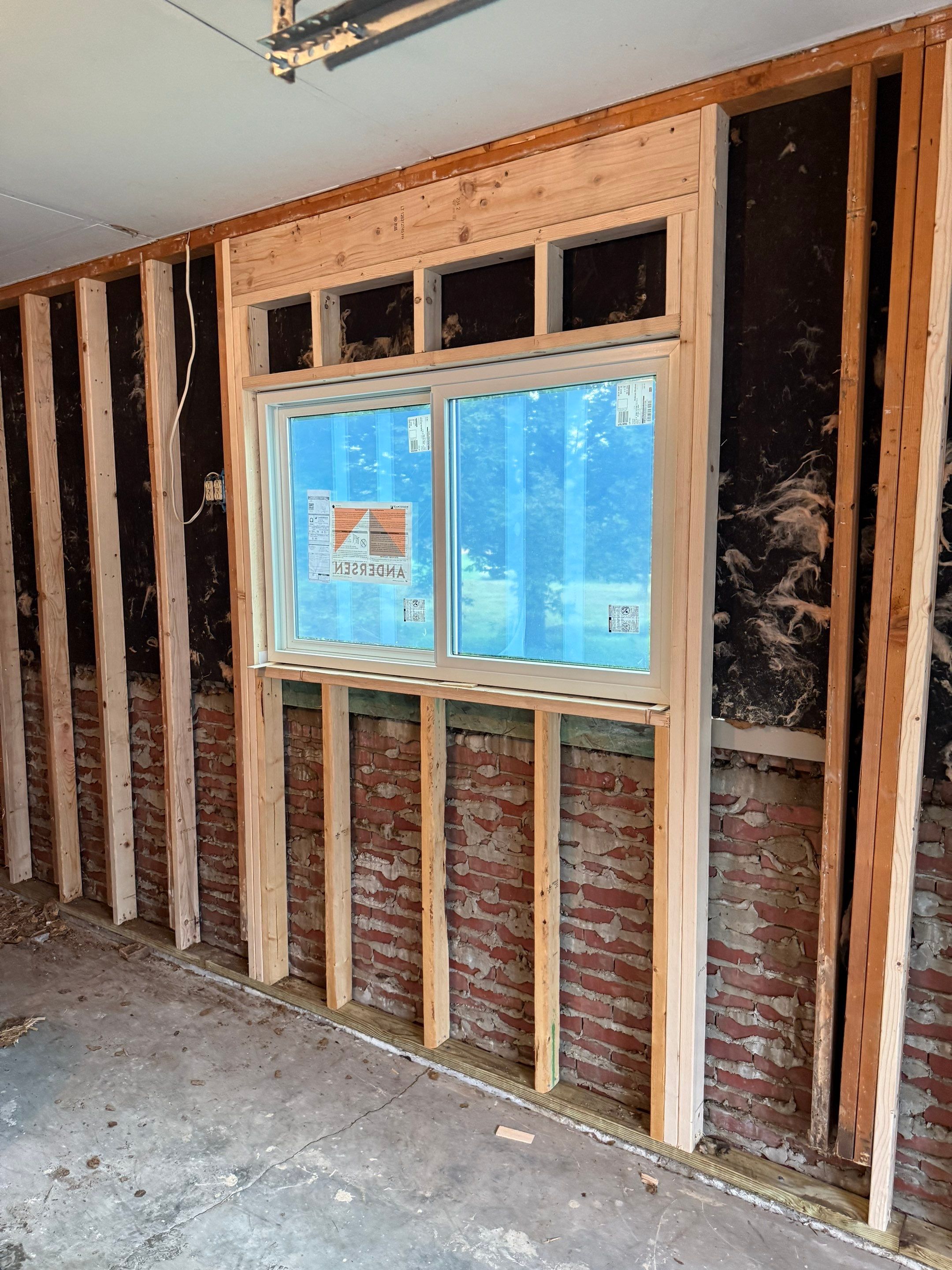 Yankton Garage Remodel with Andersen Window Installation and Drywall by Select Painting, Coatings & Garage Cabinets
